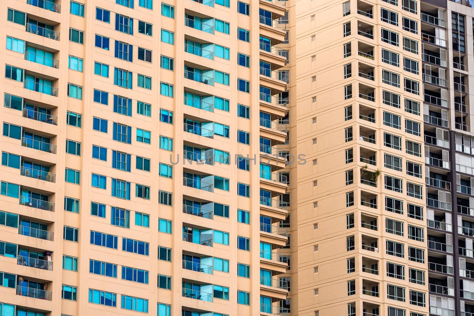 Close up view of a yellow block of flats facade packed of windows in Sydney, Australia