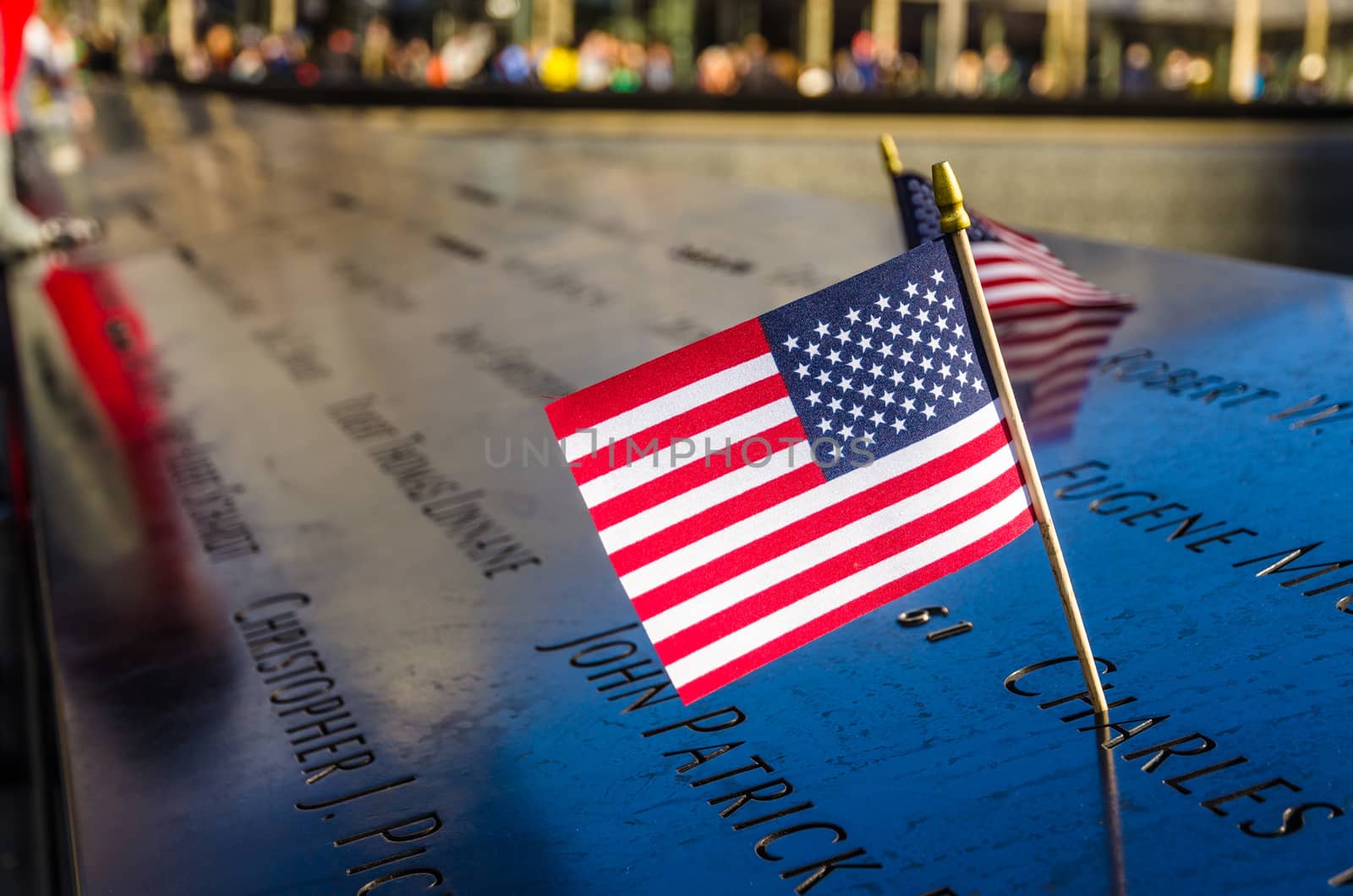 Close up of the USA flag on the 9 11 Memorial next to the One World trade centre in Manhattan, New York