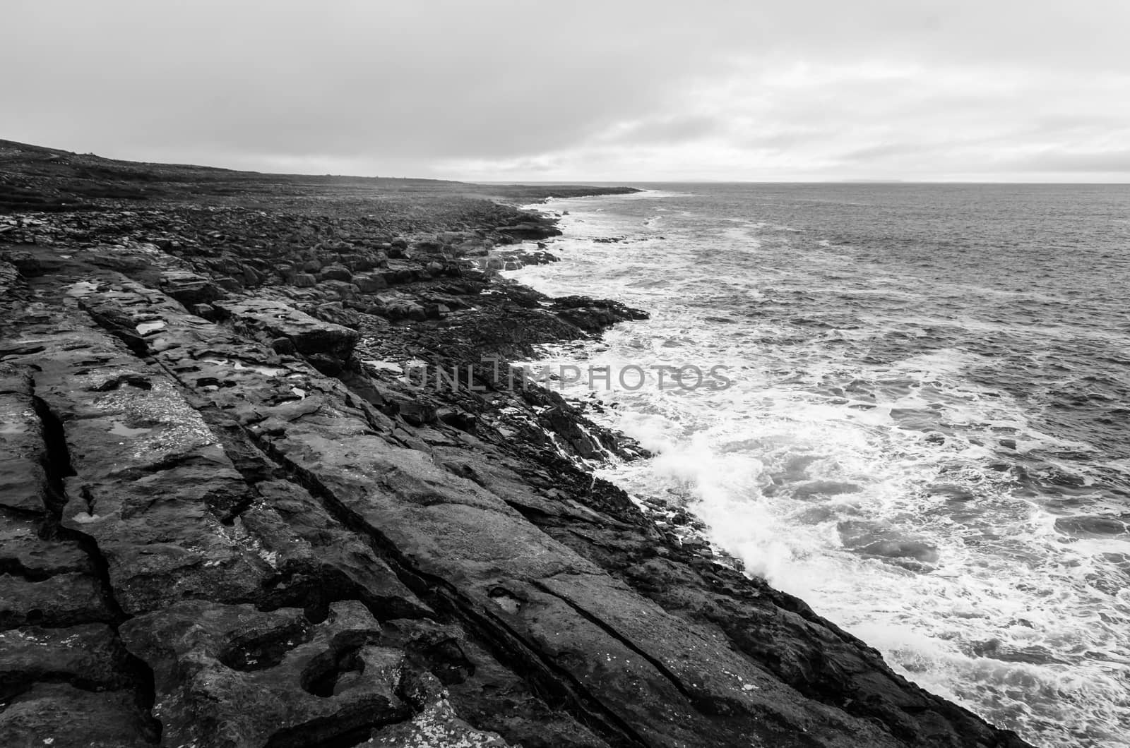Black and white seascape of Irish cliffs in stormy weather, Ireland