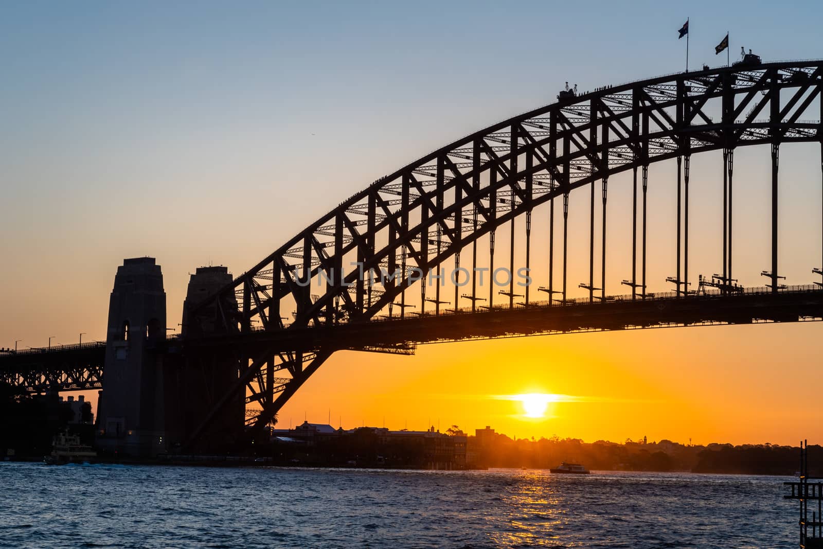 Backlight photo of Harbour Bridge at sunset, Sydney by mauricallari