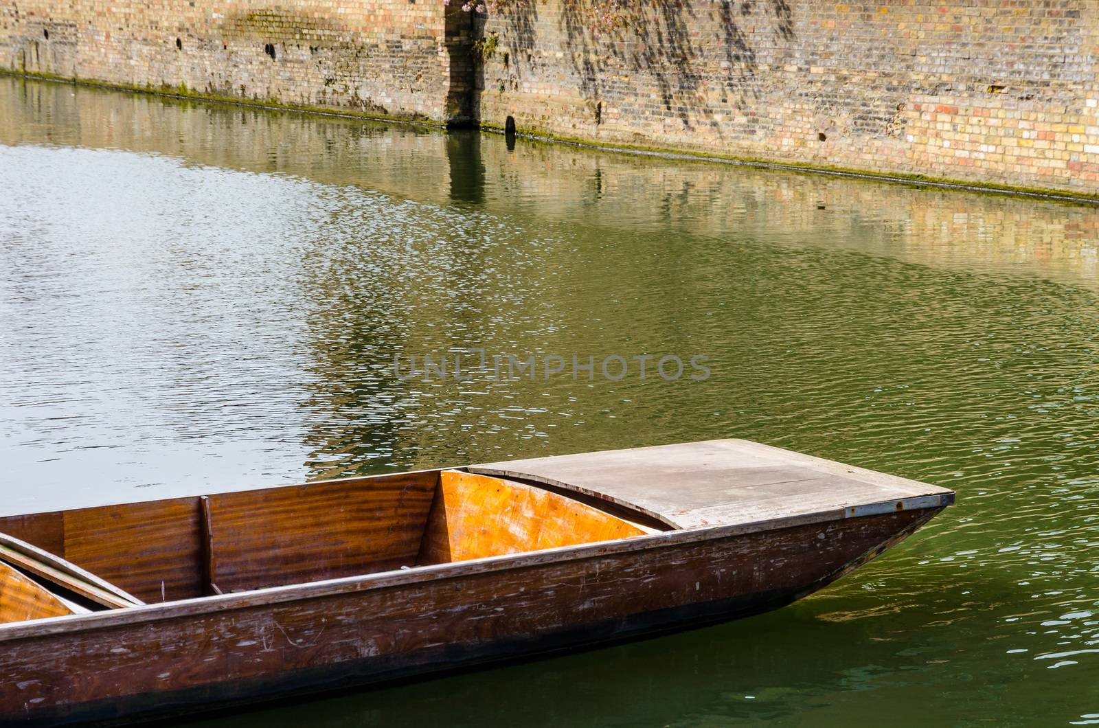 Close up of a punt on river Cam in Cambridge, United Kingdom by mauricallari
