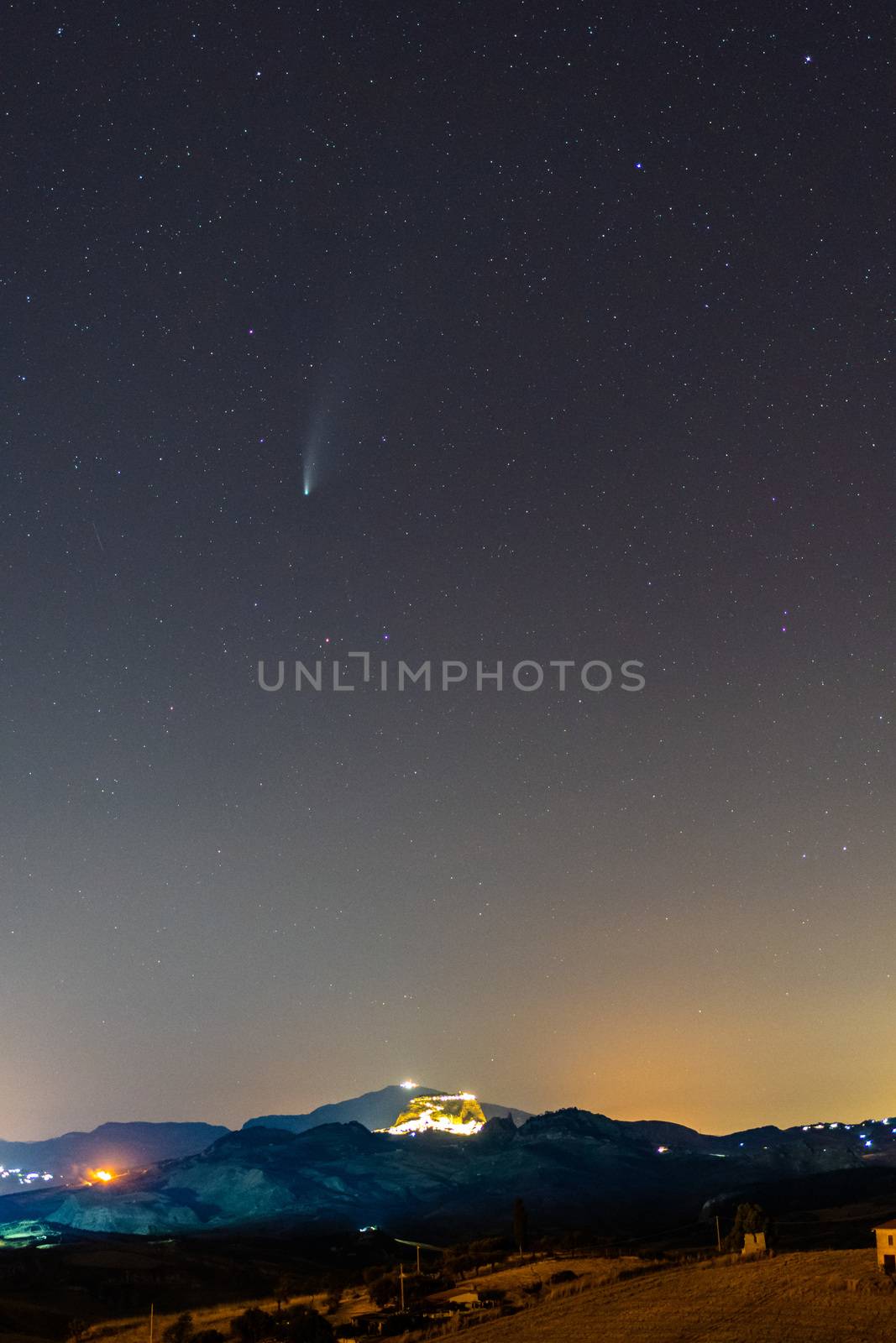 Neowise Comet and its long dust above Sutera medieval town by mauricallari