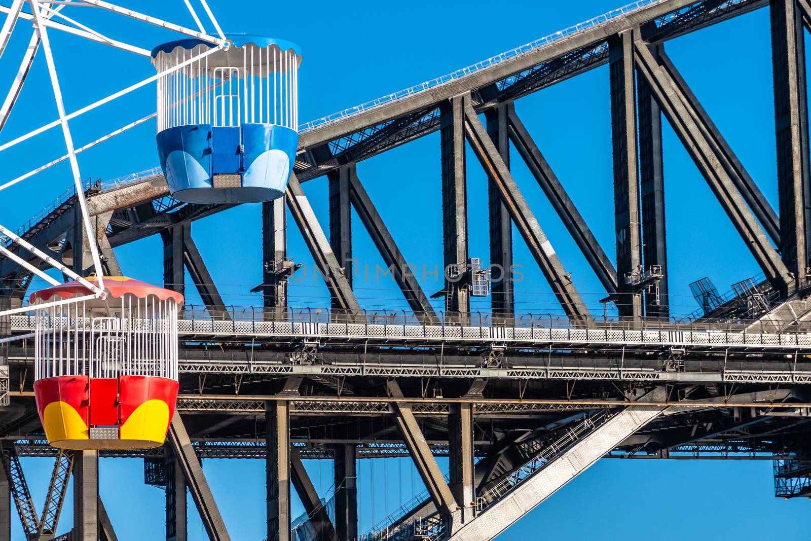 Close up of Sydney ferry wheel seats and Harbour Bridge on a blue sky background