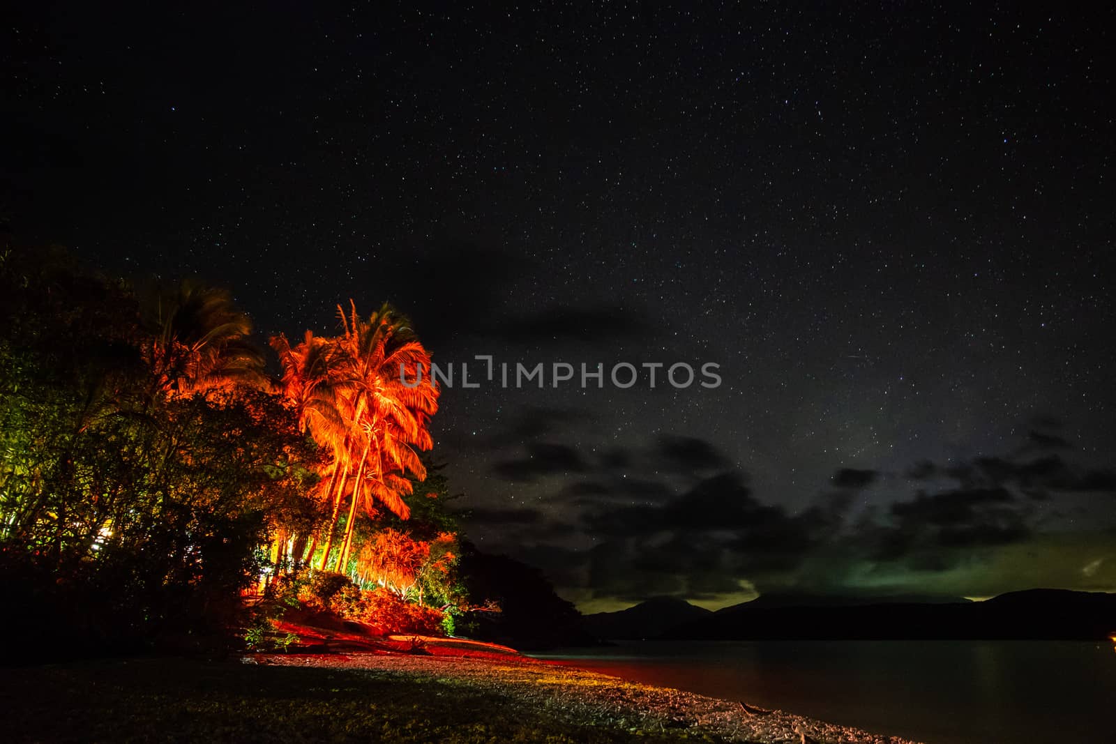 Starry night sky from Fitzroy Island beach, Queensland, Australia by mauricallari