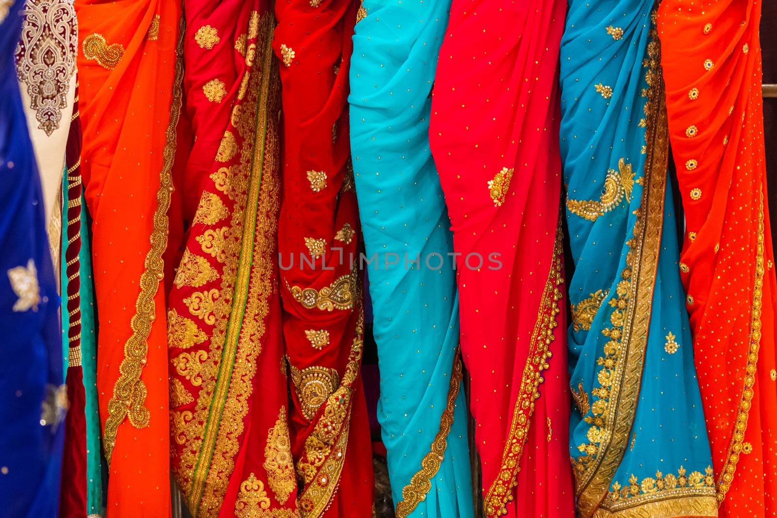 Close up of colourful and decorated Indian dresses by mauricallari
