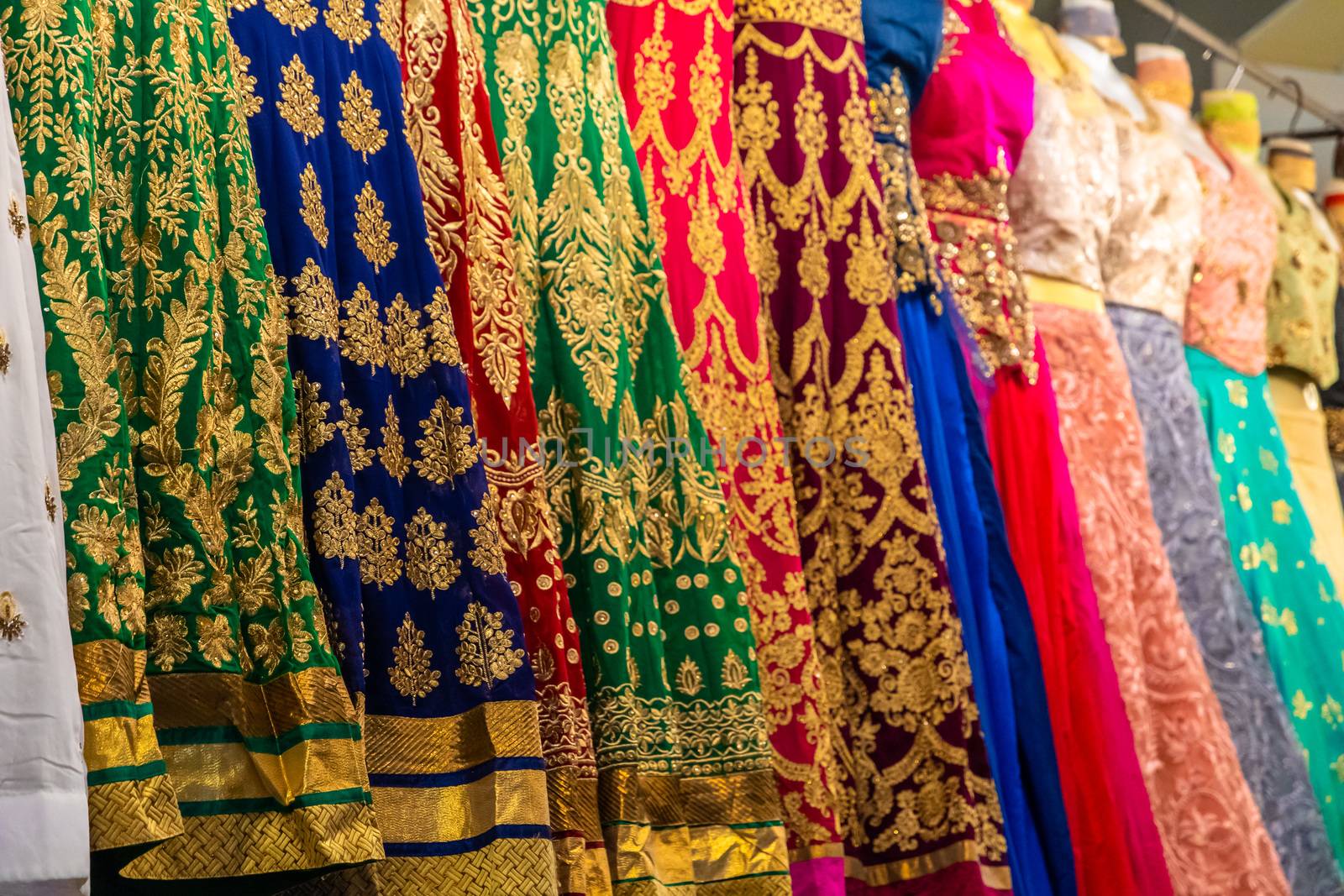 Close up of colourful and decorated Indian dresses by mauricallari