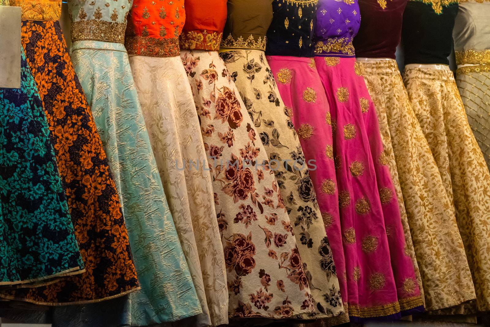 Close up of colourful and decorated Indian dresses in a market