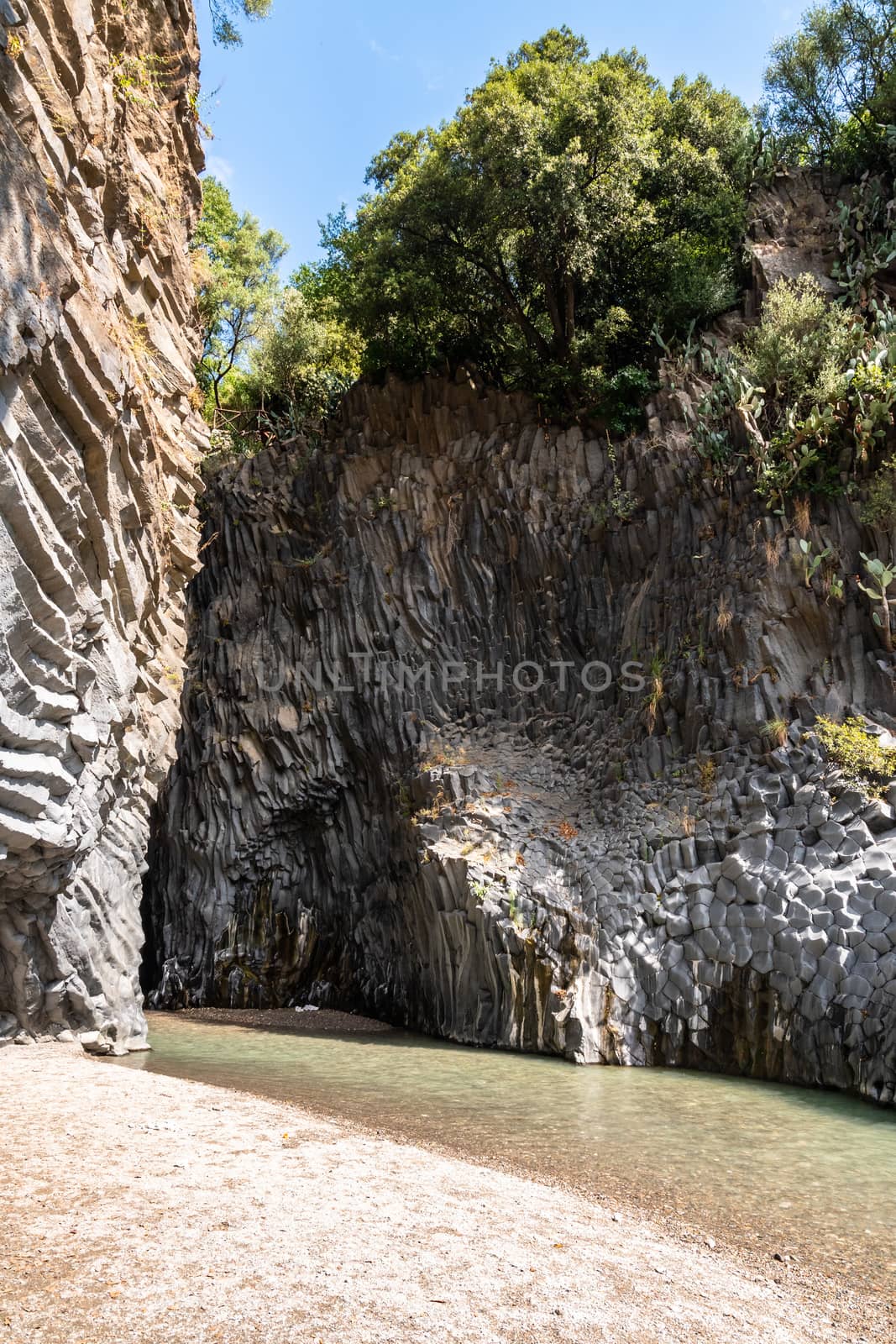 Basalt rocks and pristine water of Alcantara gorges in Sicily, Italy by mauricallari