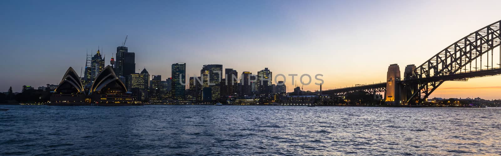 Sydney, NSW - Oct 2018: Panoramic view of the bay at sunset by mauricallari