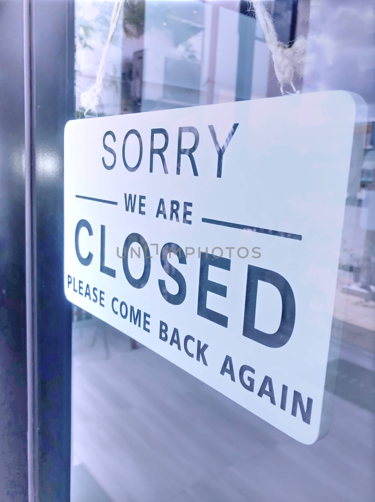 The sign of the coffee shop shows a temporary closure due to the by noppha80