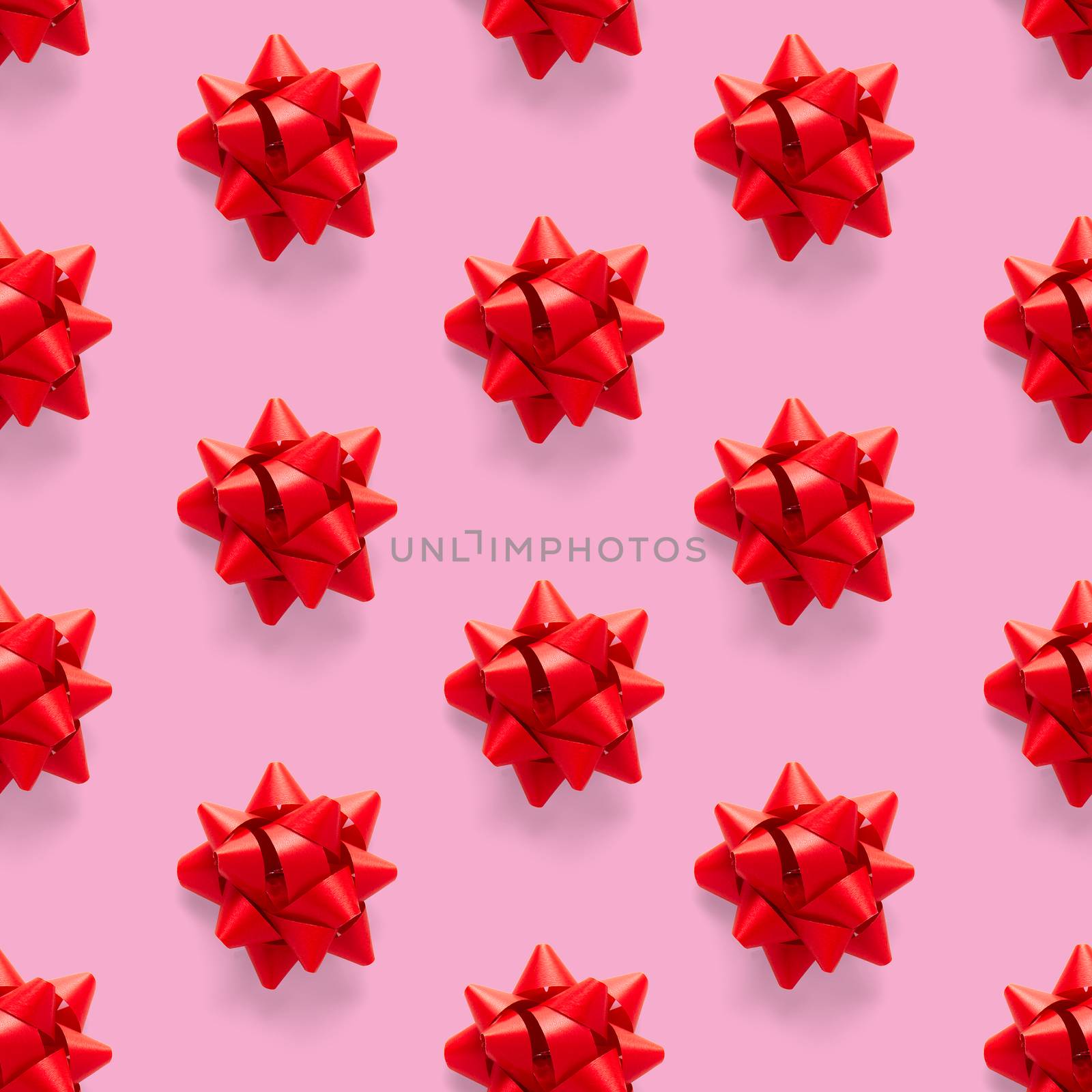 Seamless regular creative Christmas pattern with New Year decorations on pink background. xmas Modern Seamless pattern made from christmas decorations. Photo quality pattern for fabric, prints, wallpapers, banners or creative design works.