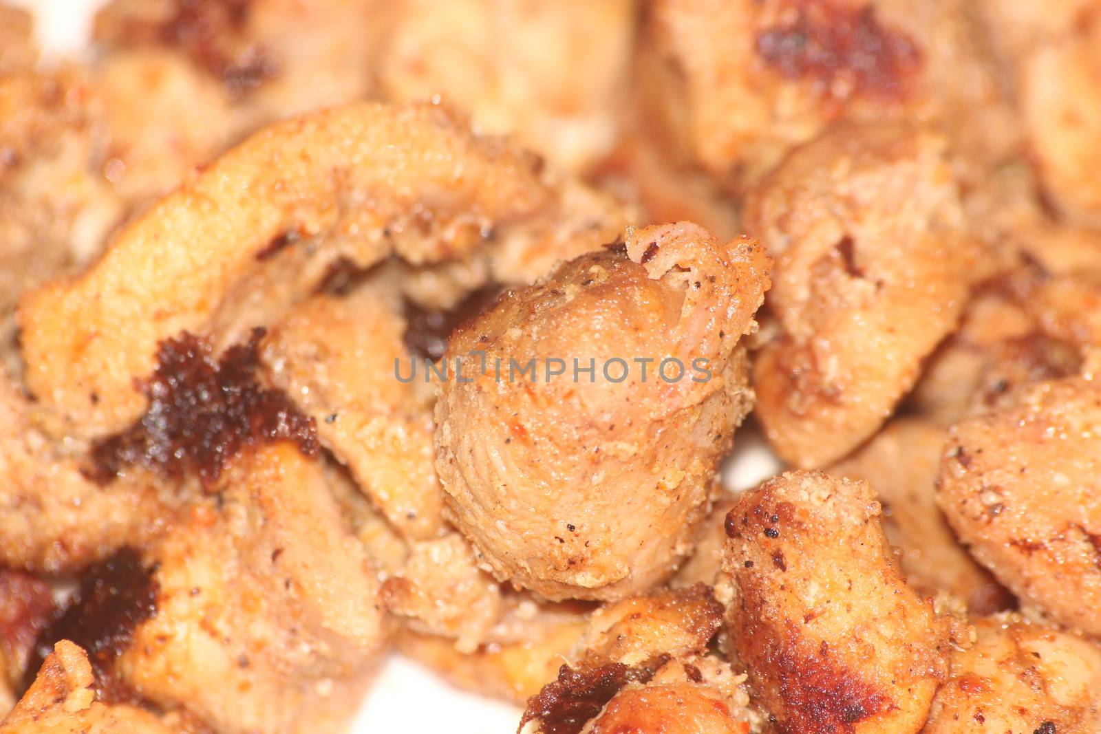 Macro closeup with selective focus on grilled chicken meat steaks. non-vegetarian concept.
