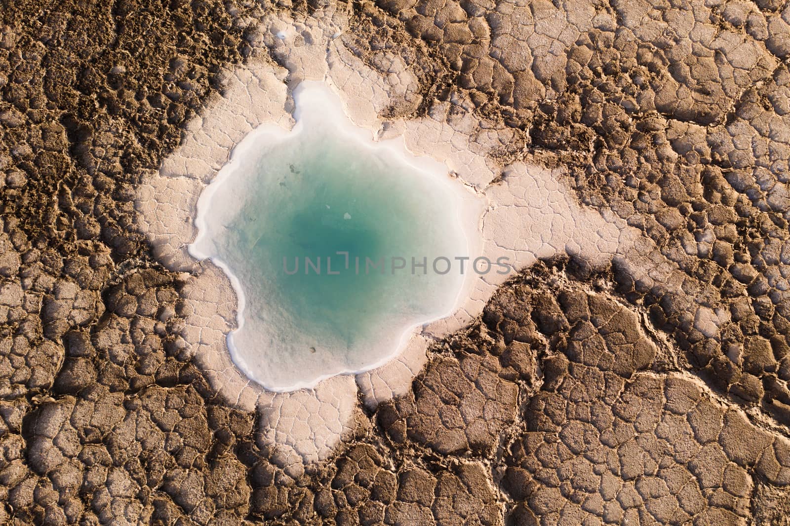Salt pond in the dry land in Qinghai, China. by vinkfan