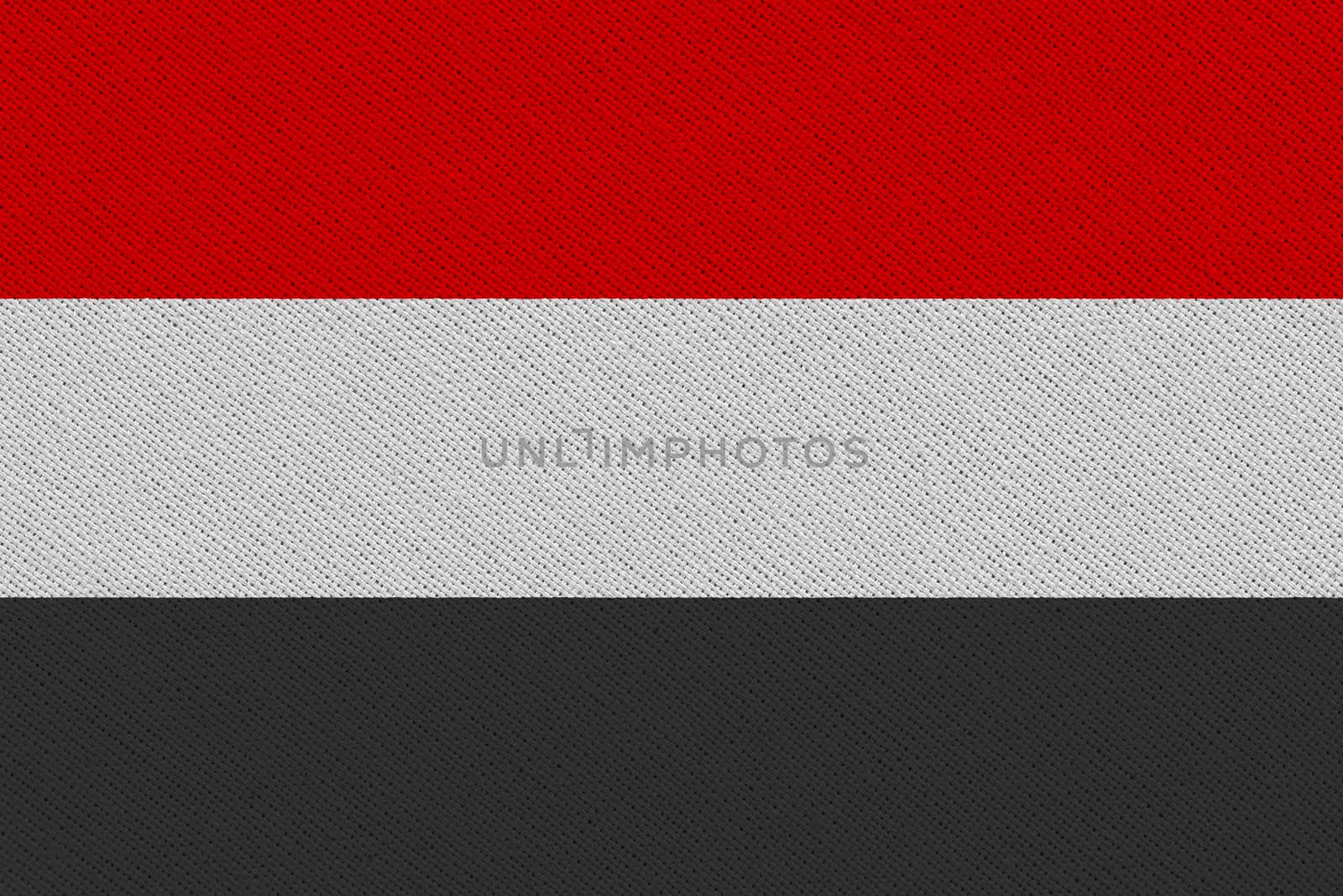 Yemen fabric flag. Patriotic background. National flag of Yemen