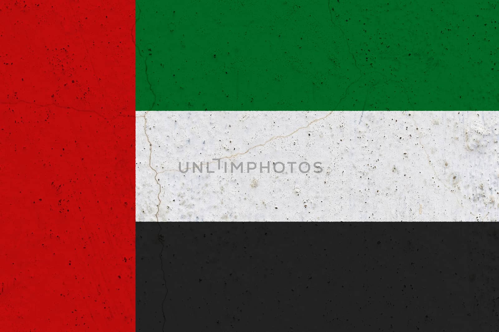 United arab flag on concrete wall. Patriotic grunge background. National flag of United arab