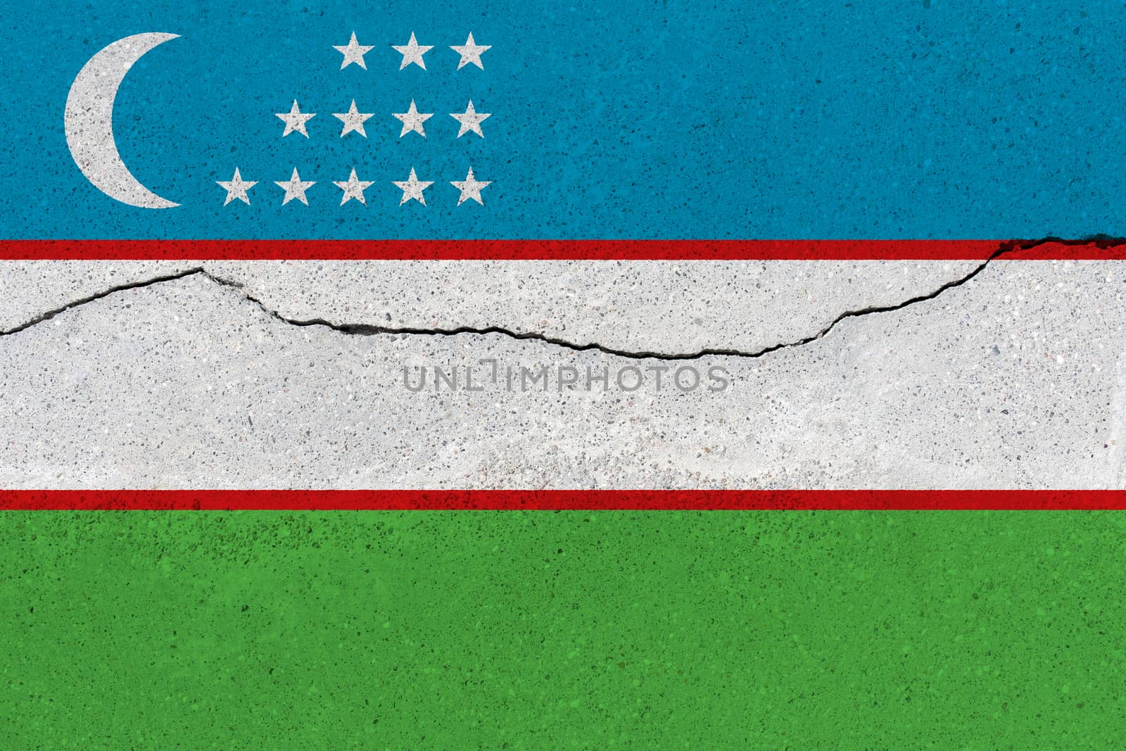 Uzbekistan flag on concrete wall with crack. Patriotic grunge background. National flag of Uzbekistan