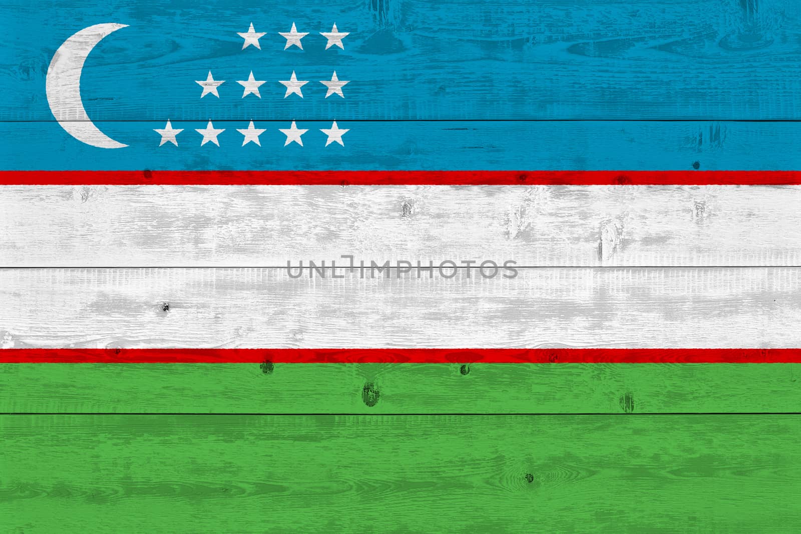 Uzbekistan flag painted on old wood plank. Patriotic background. National flag of Uzbekistan