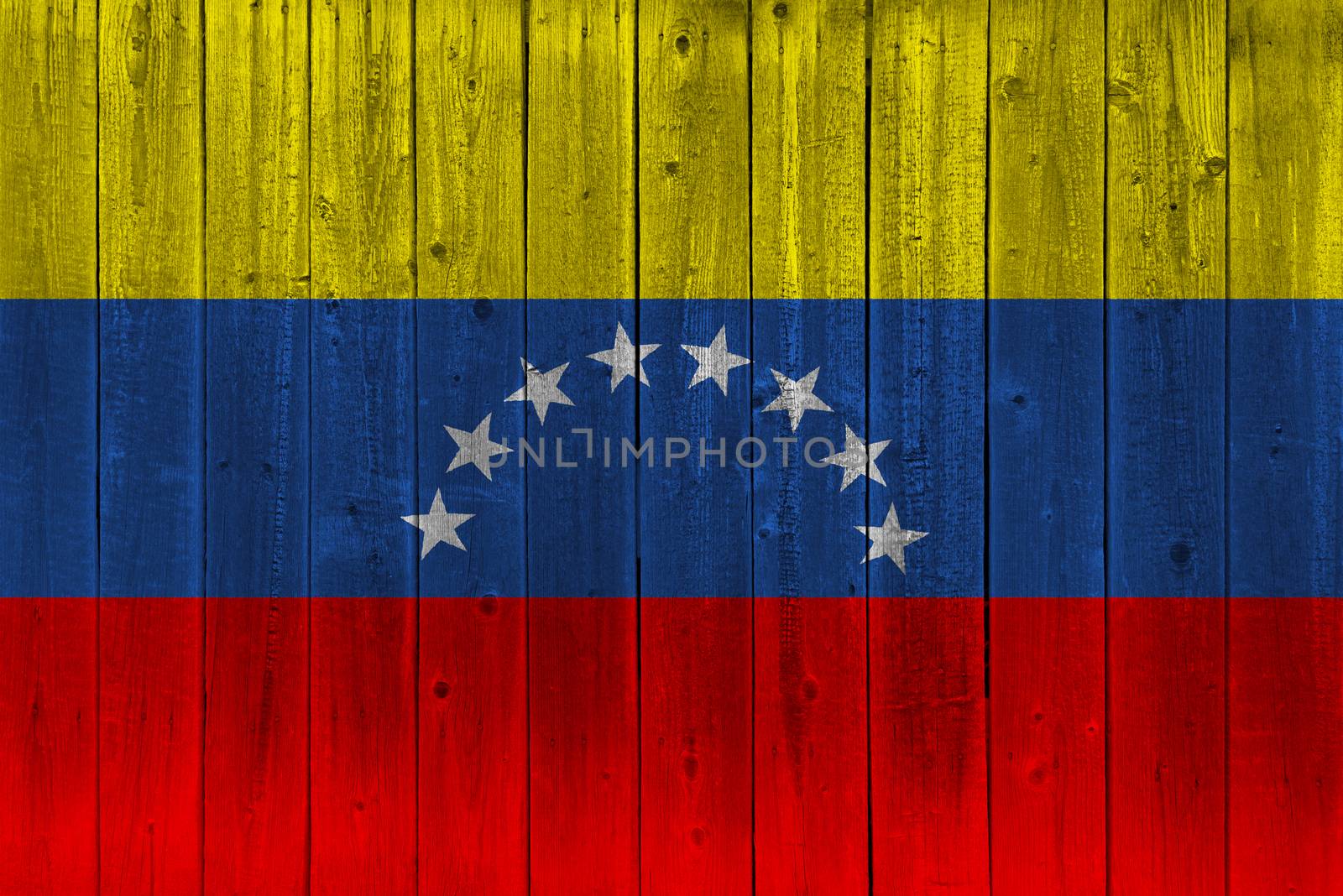 Venezuela flag painted on old wood plank. Patriotic background. National flag of Venezuela