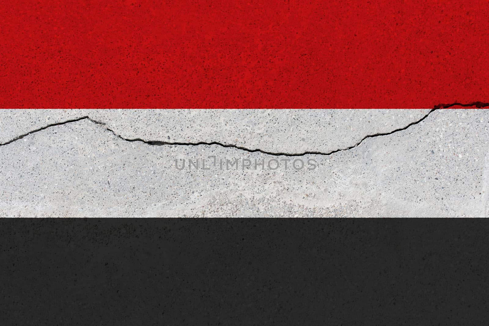 Yemen flag on concrete wall with crack. Patriotic grunge background. National flag of Yemen