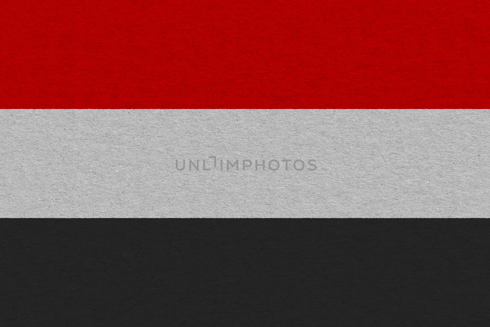 Yemen flag painted on paper. Patriotic background. National flag of Yemen
