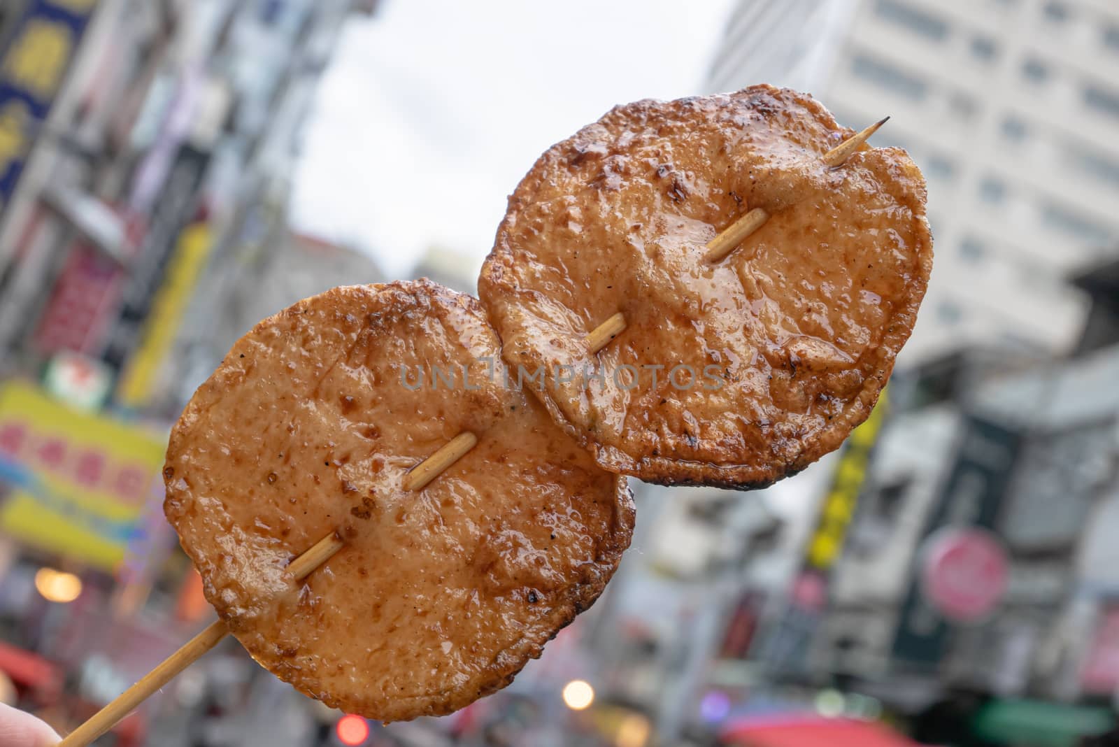 The close up of Taiwanese traditional barbecue (BBQ) food  at night market background in Taiwan.