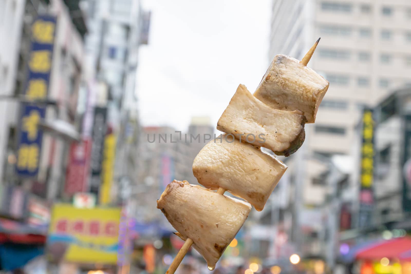 The close up of Taiwanese traditional barbecue (BBQ) food  at night market background in Taiwan.