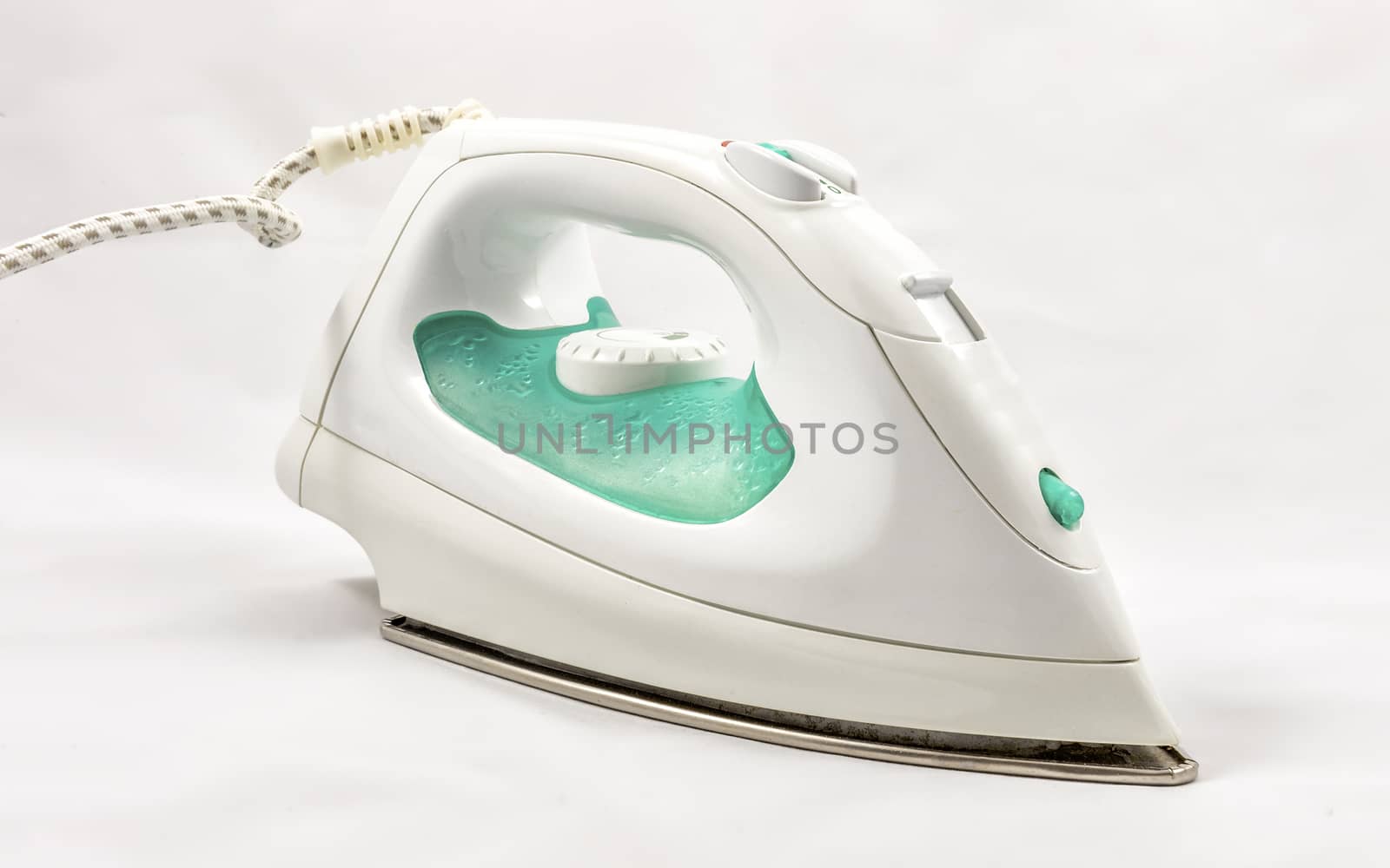 Electric steam flat iron, isolated on white background