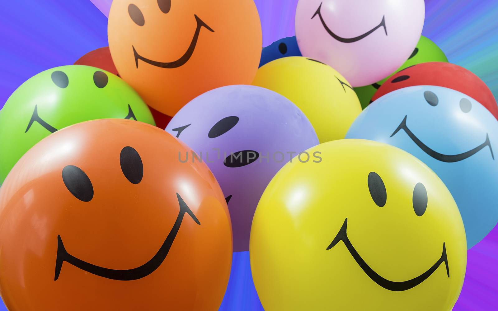 Colorful bunch of smiley balloons. Concept for joy, party and good mood