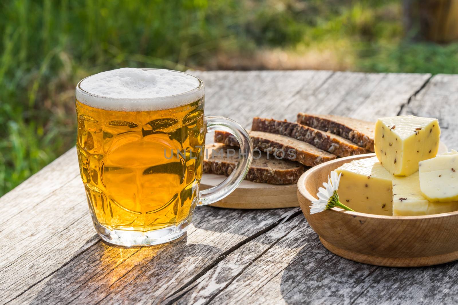 Glass of light beer with cheese and rye bread. Preparing Ligo festival. Riga. Latvia