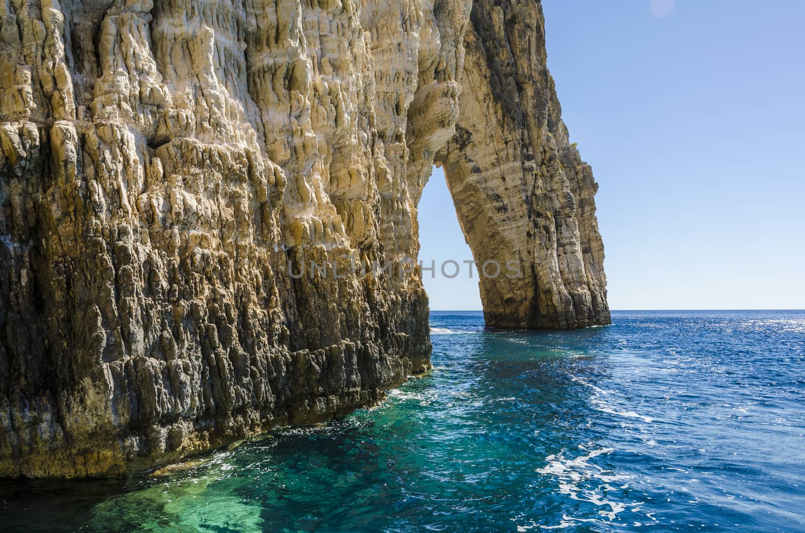 view of reefs with an opening pierced by the Ionian sea on the shores of the island of zakynthos