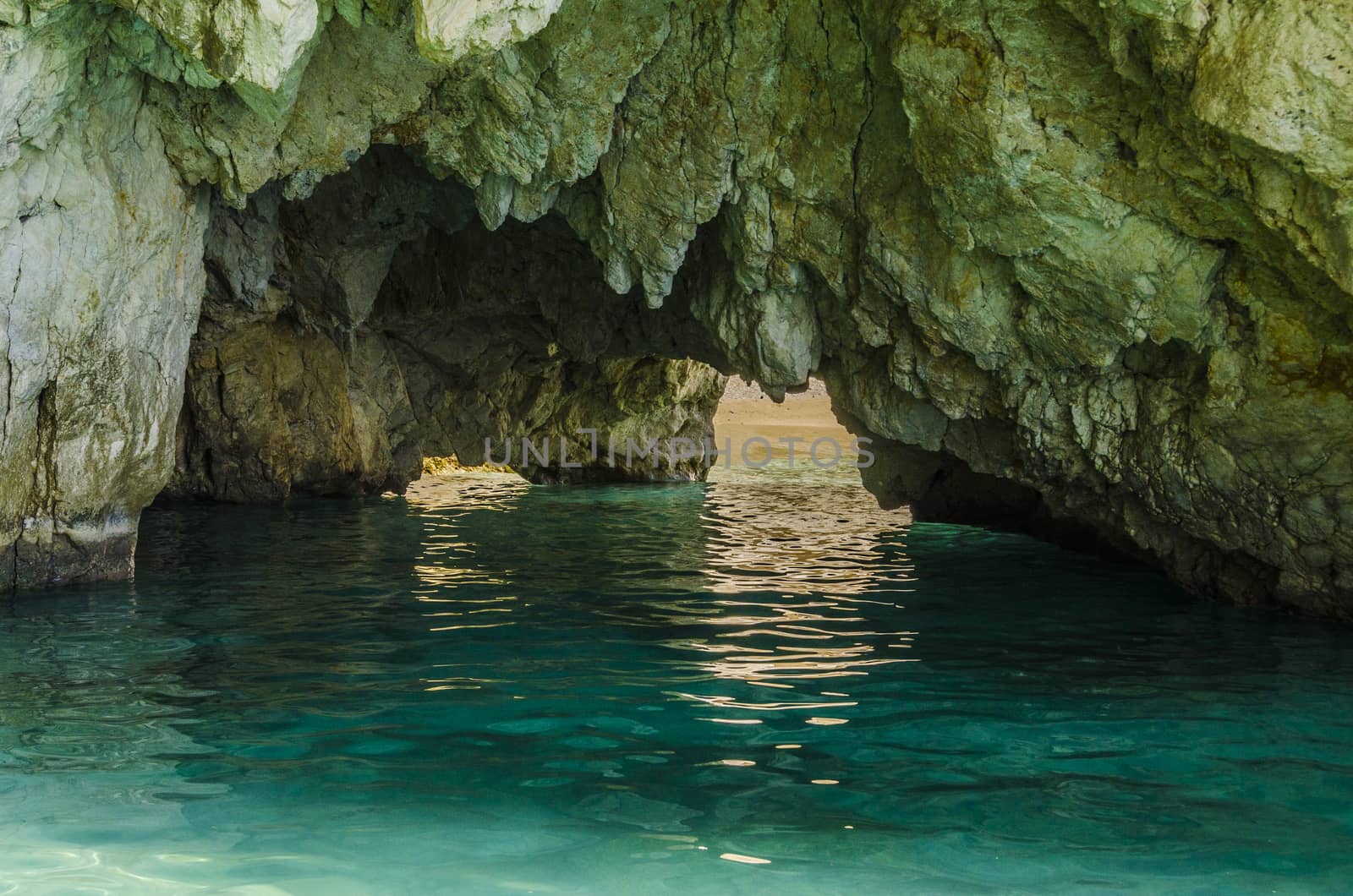 cave with multiple entrances and beach on the island of zakynthos