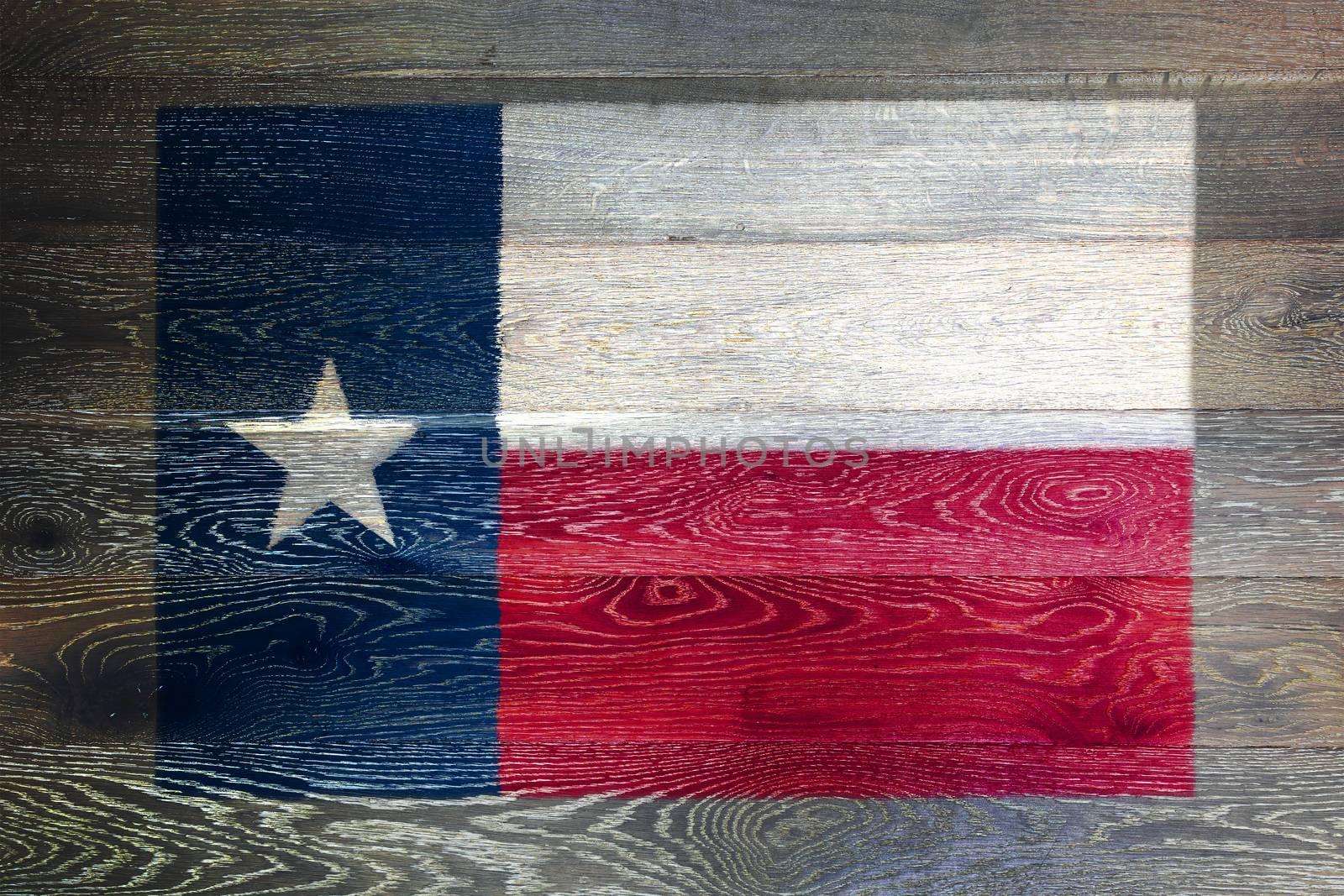 A Texas flag on rustic old wood surface background
