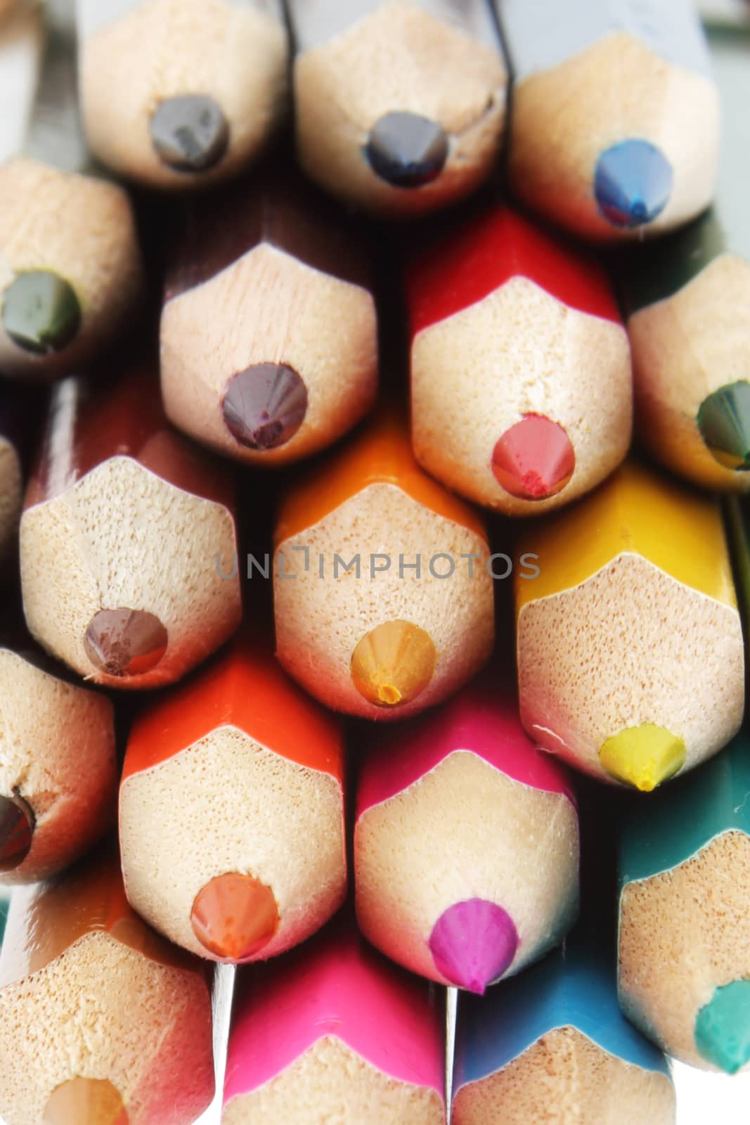 A collection of multi colored pencils close up with differential focus