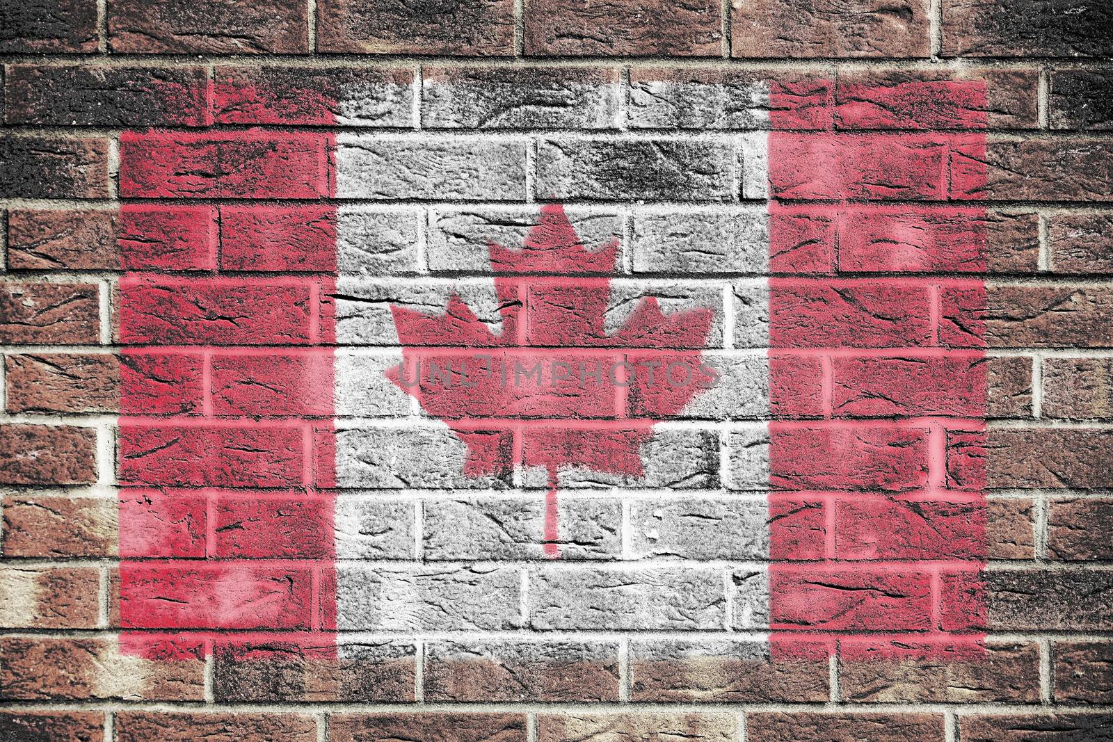 A Canada flag on a brick wall background
