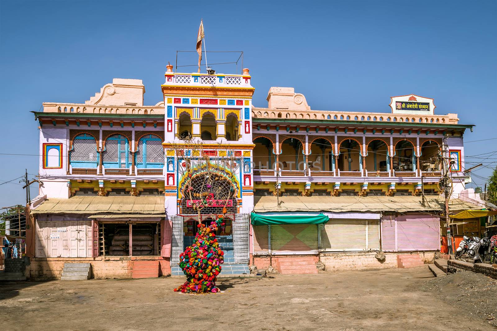 Brightly colored , freshly painted goddess Ambadevi temple with by lalam