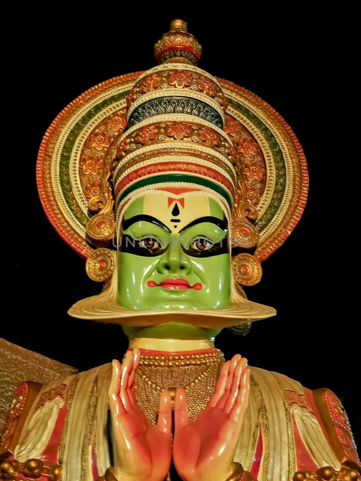 Image of porcelain idol face of Kerala Kathakali performer & black background. by lalam
