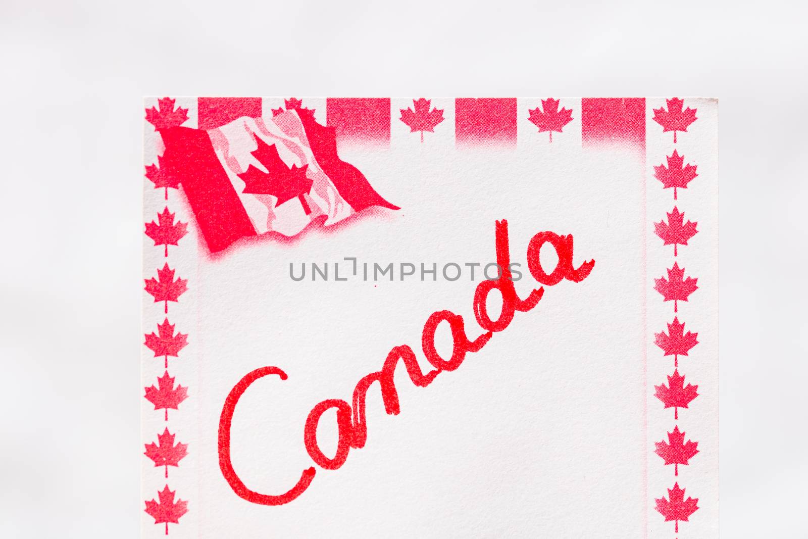 Canada handwriting on paper with Canada flag. Writing text on me by vladispas