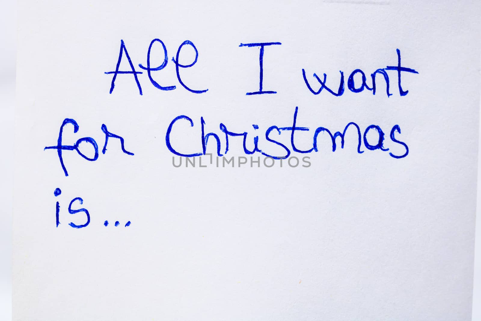 All I want for Christmas handwriting text close up isolated on w by vladispas