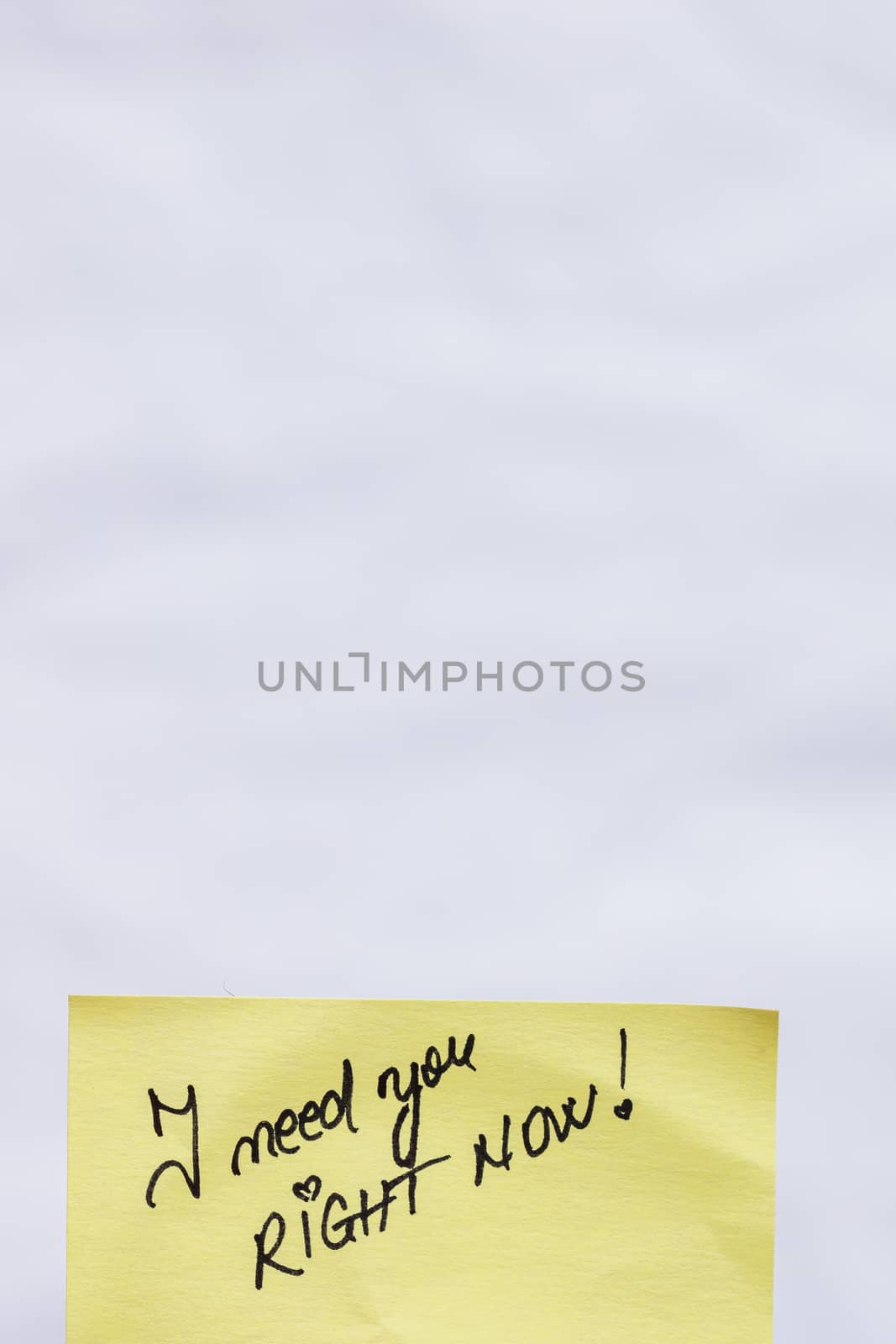 I need you right now handwriting text close up isolated on yellow paper with copy space.