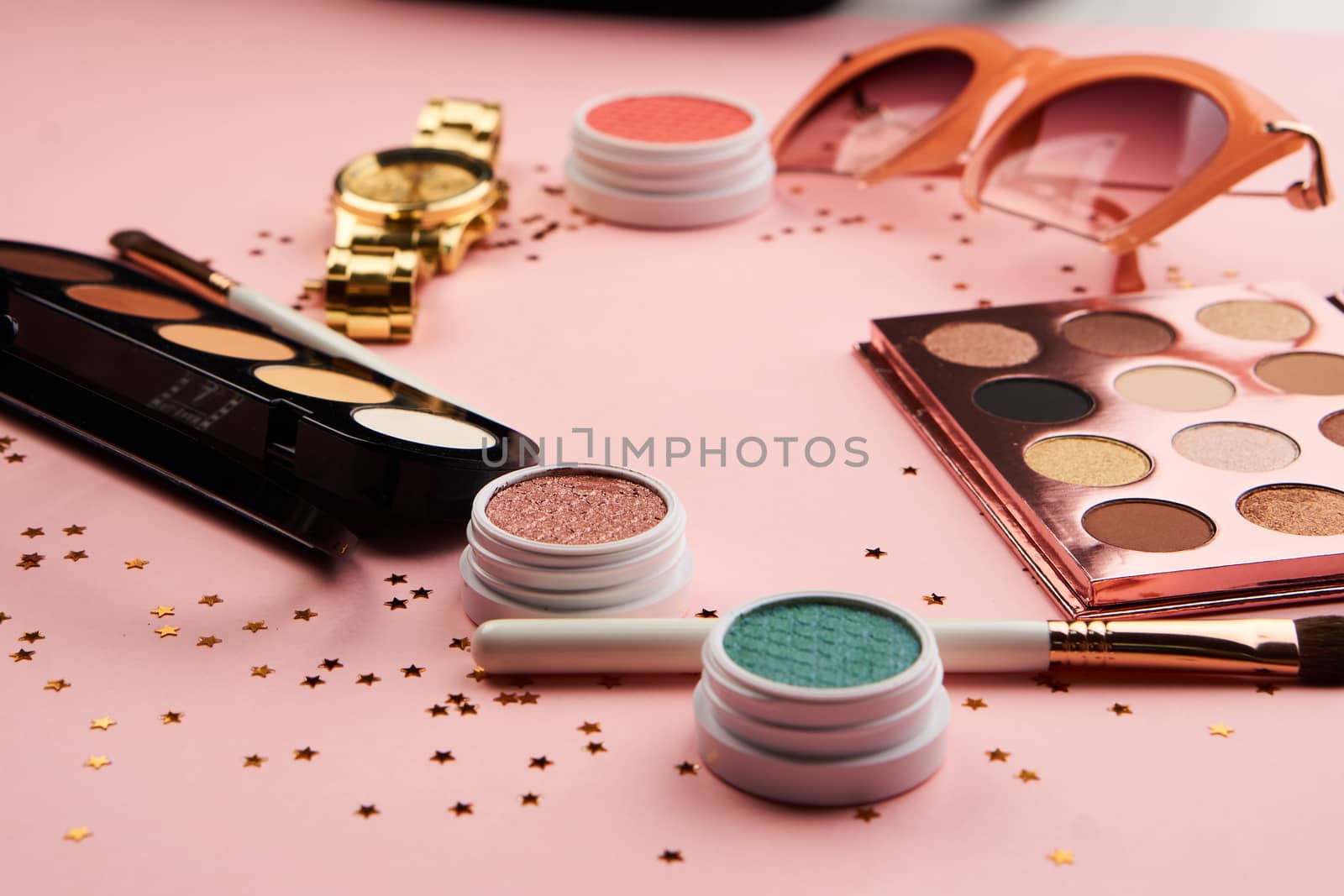 eyeshadow accessories beads makeup brushes collection professional cosmetics on pink background. High quality photo