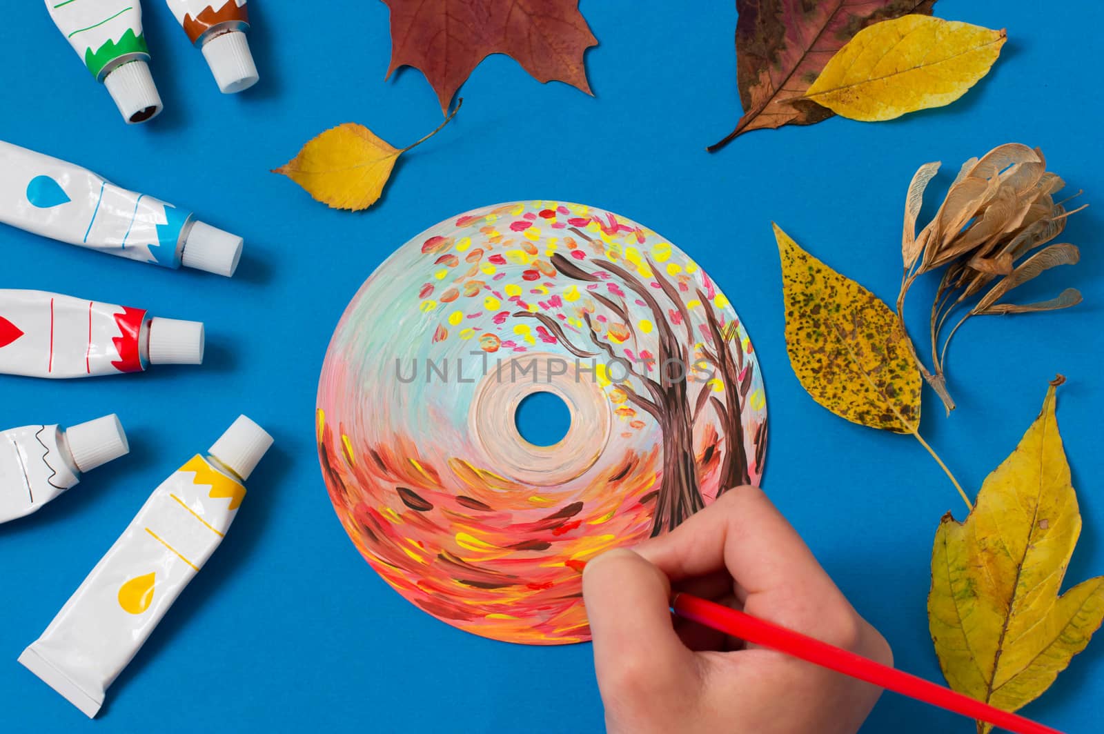 Painting with acrylics paints on CD. Seasons. Autumn landscape. Creative art project 