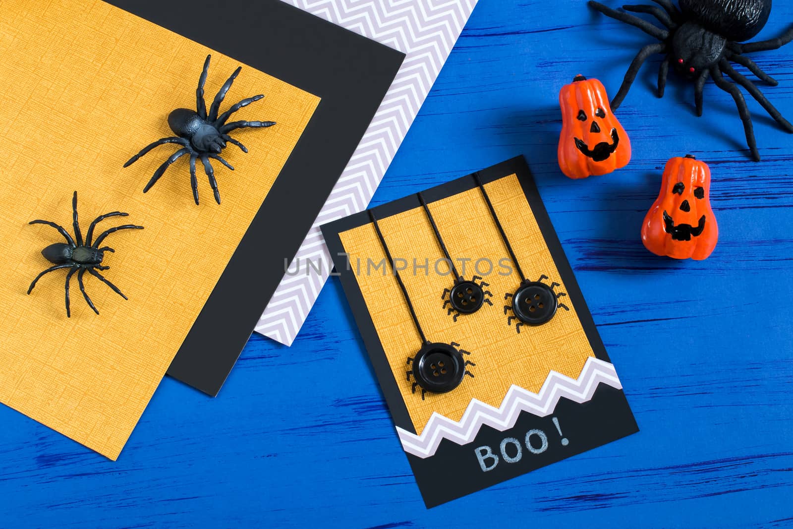 Child makes card with spiders to Halloween. Children's art project. DIY concept. Step-by-step photo instruction. Step 8. Final result