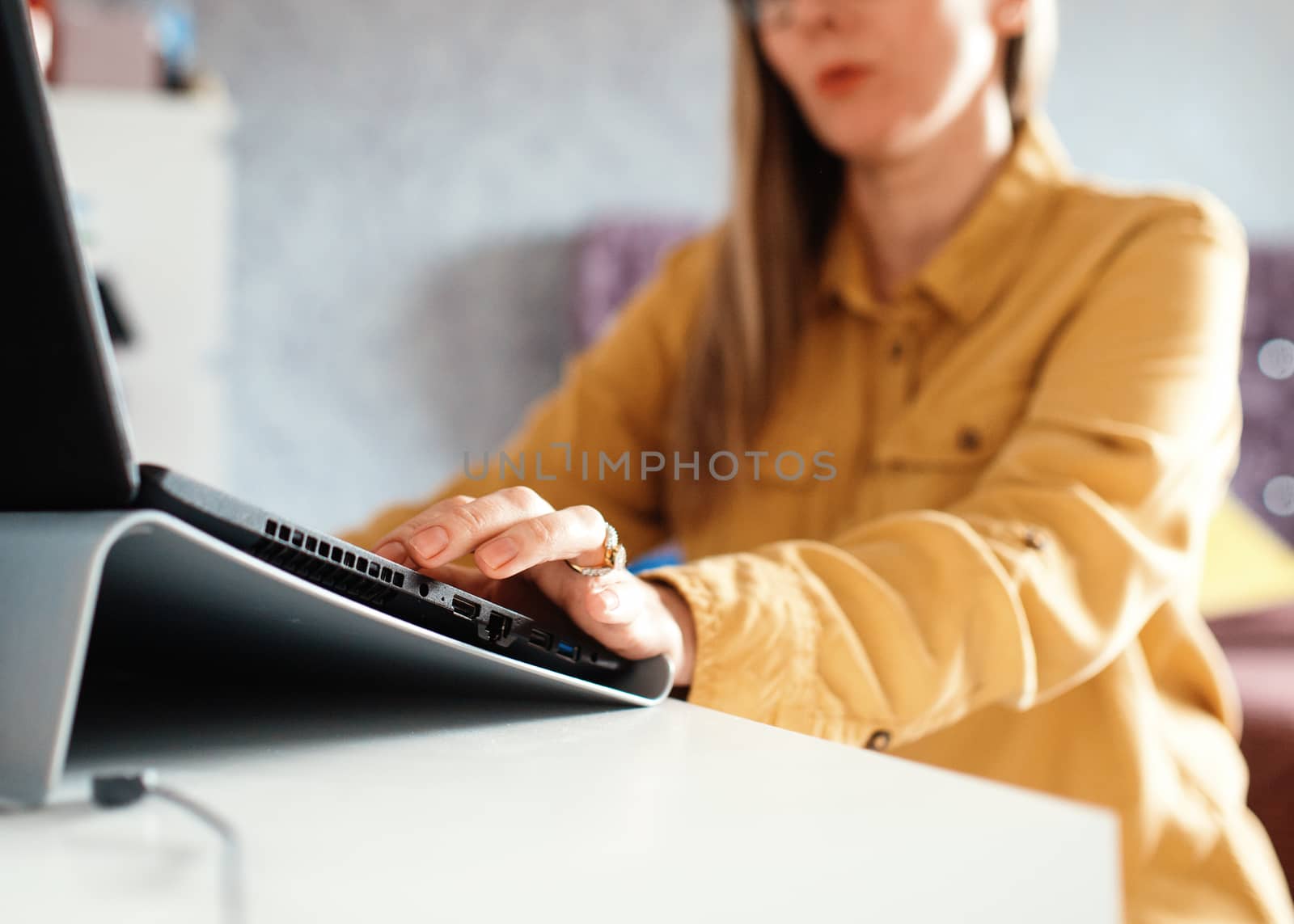 businesswoman working on laptop at home