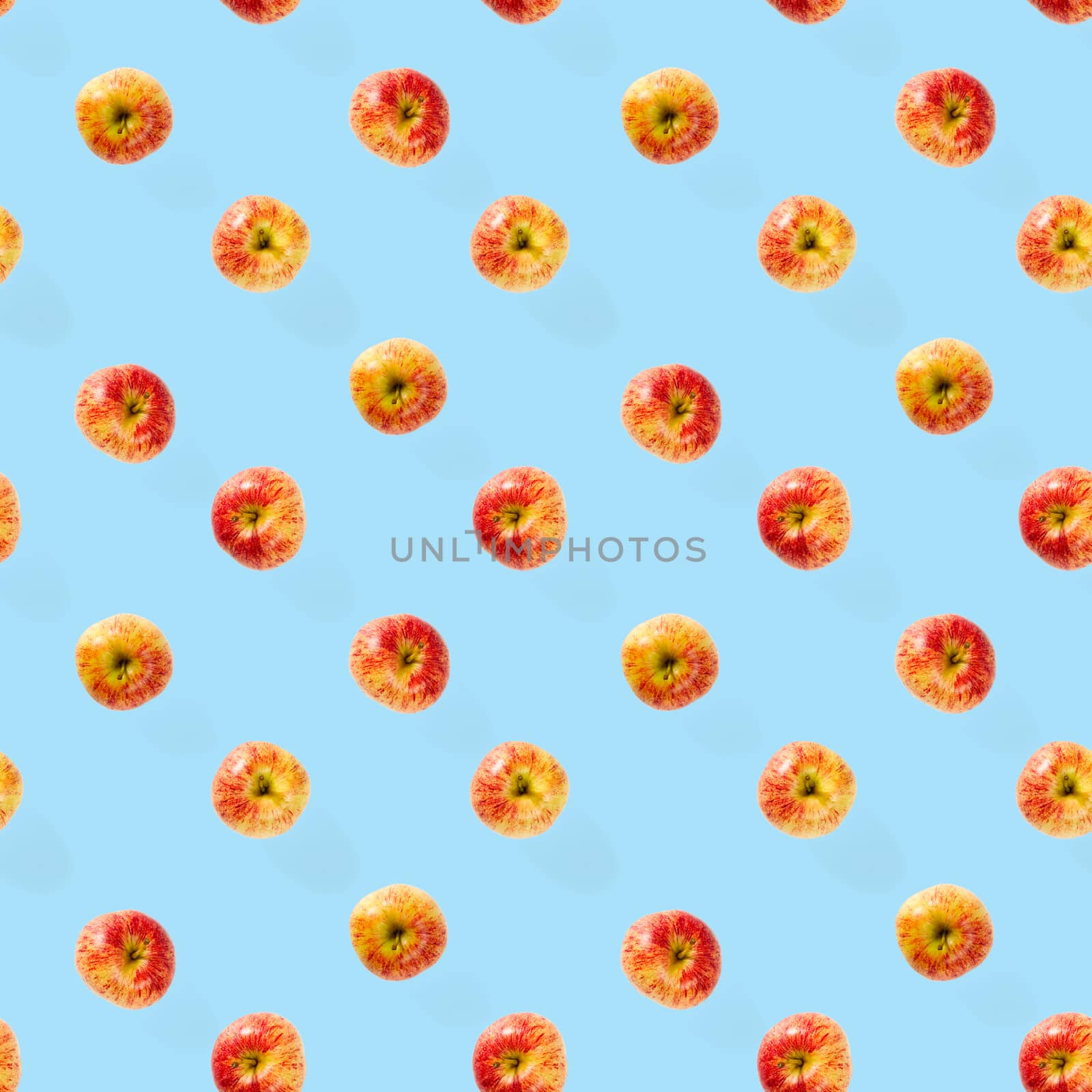 Seamless pattern with ripe apples. Apple seamless pattern on blue background. Tropical fruit abstract background.