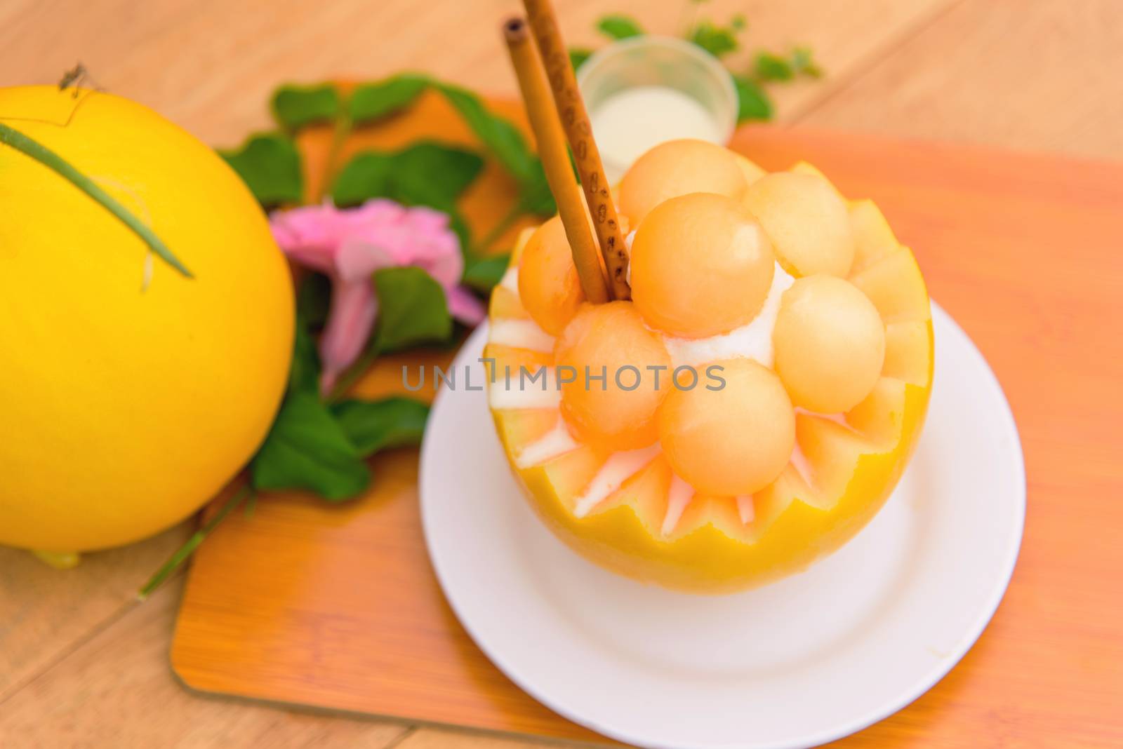 Melon Bingsoo with Sweetened Condensed Milk on wood table by rukawajung