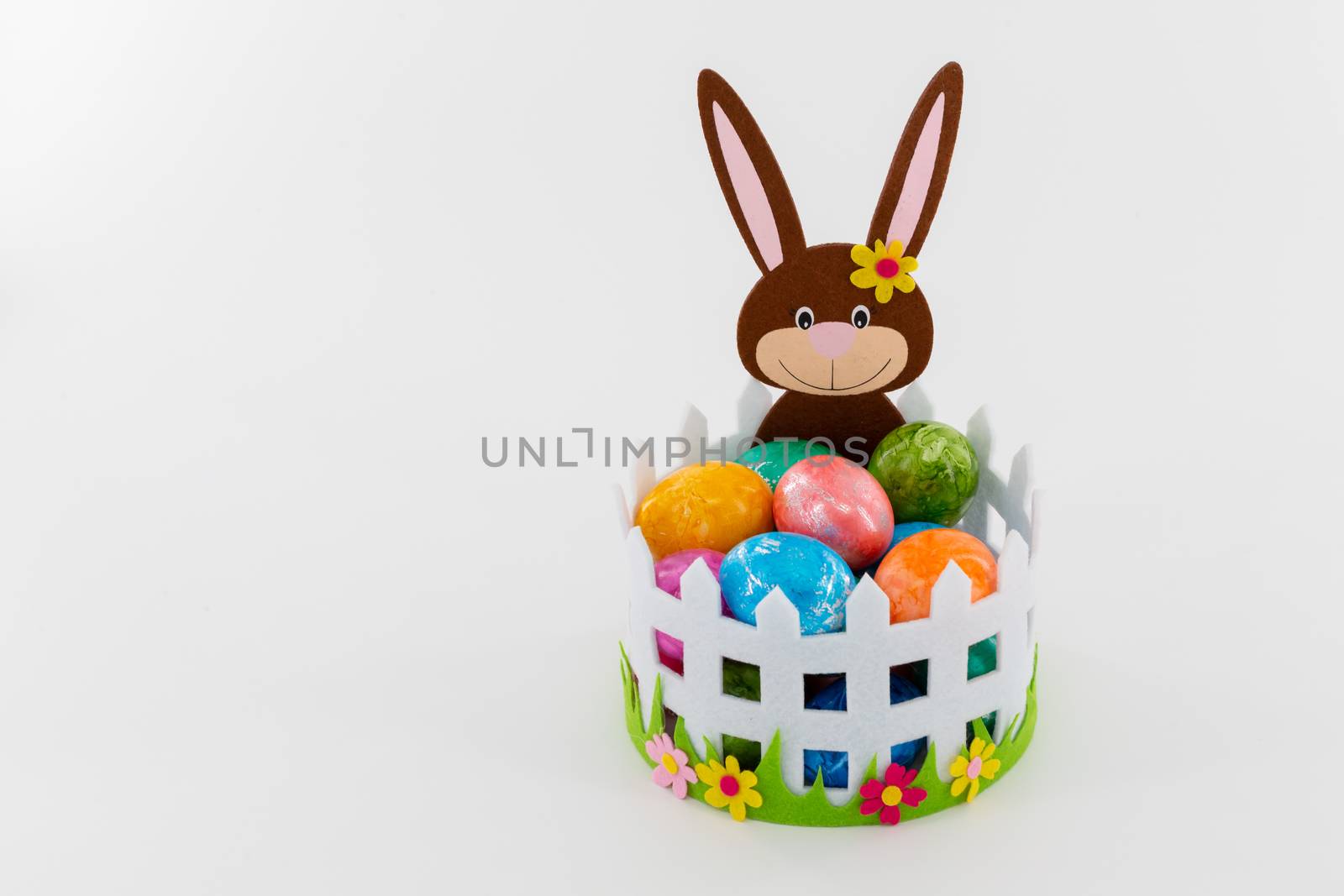 Colorful Easter eggs in a basket with an Easter bunny by 25ehaag6