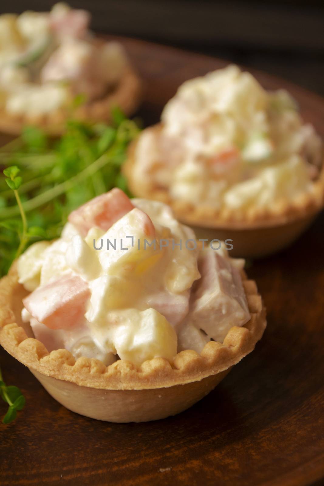 Tartlet with russian salad olivier for catering, vertical