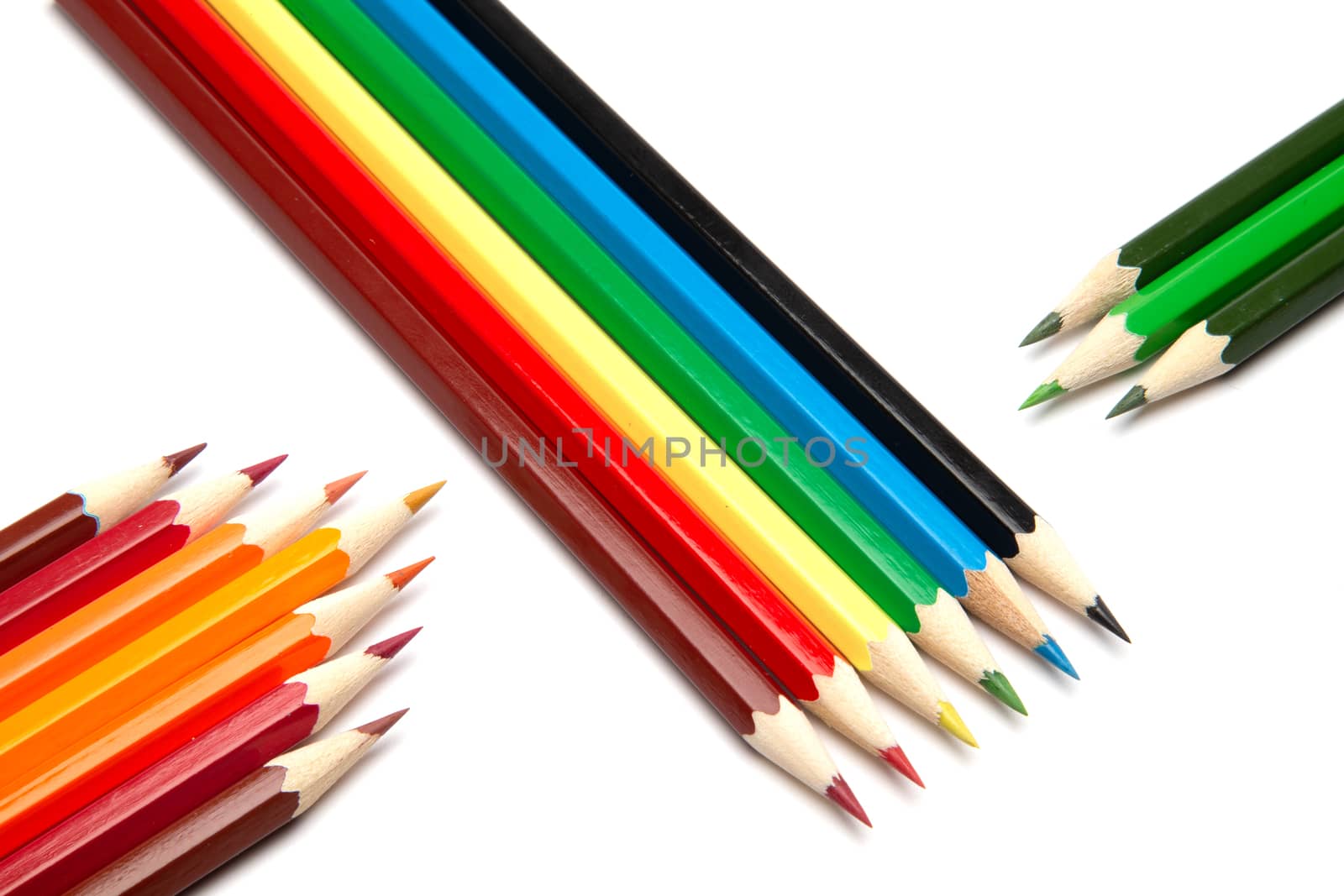 Lot of colorful wooden pencils on a white background