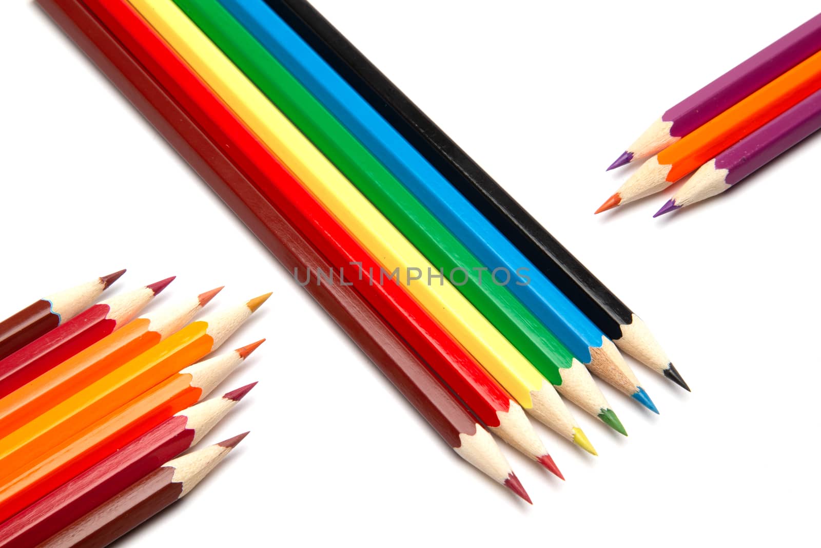 Lot of colorful wooden pencils on a white background