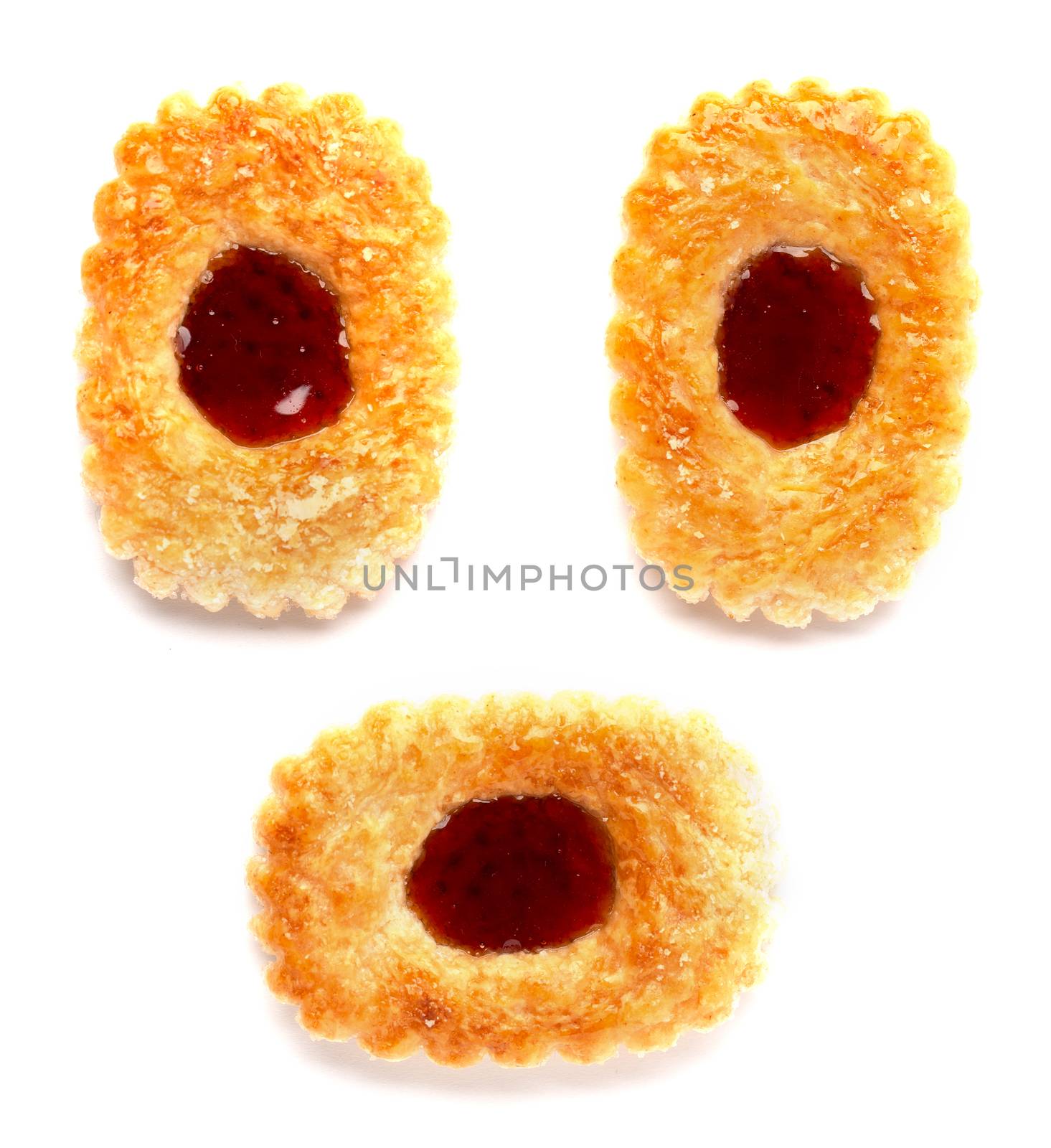 The Three cookies with a blob of jam in the middle on a white background
